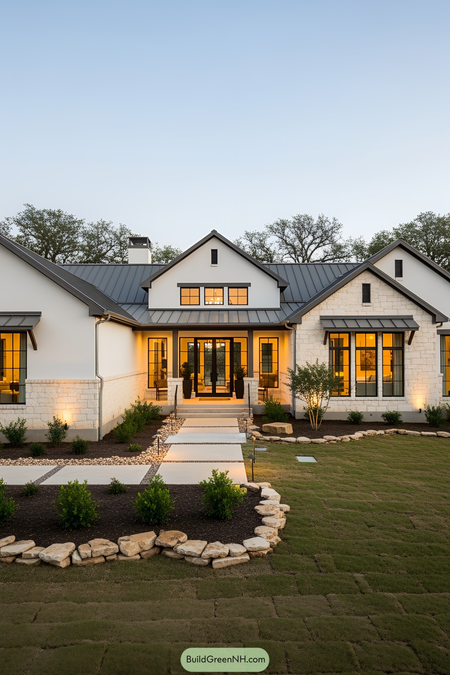 Contemporary stone ranch house with warm lights