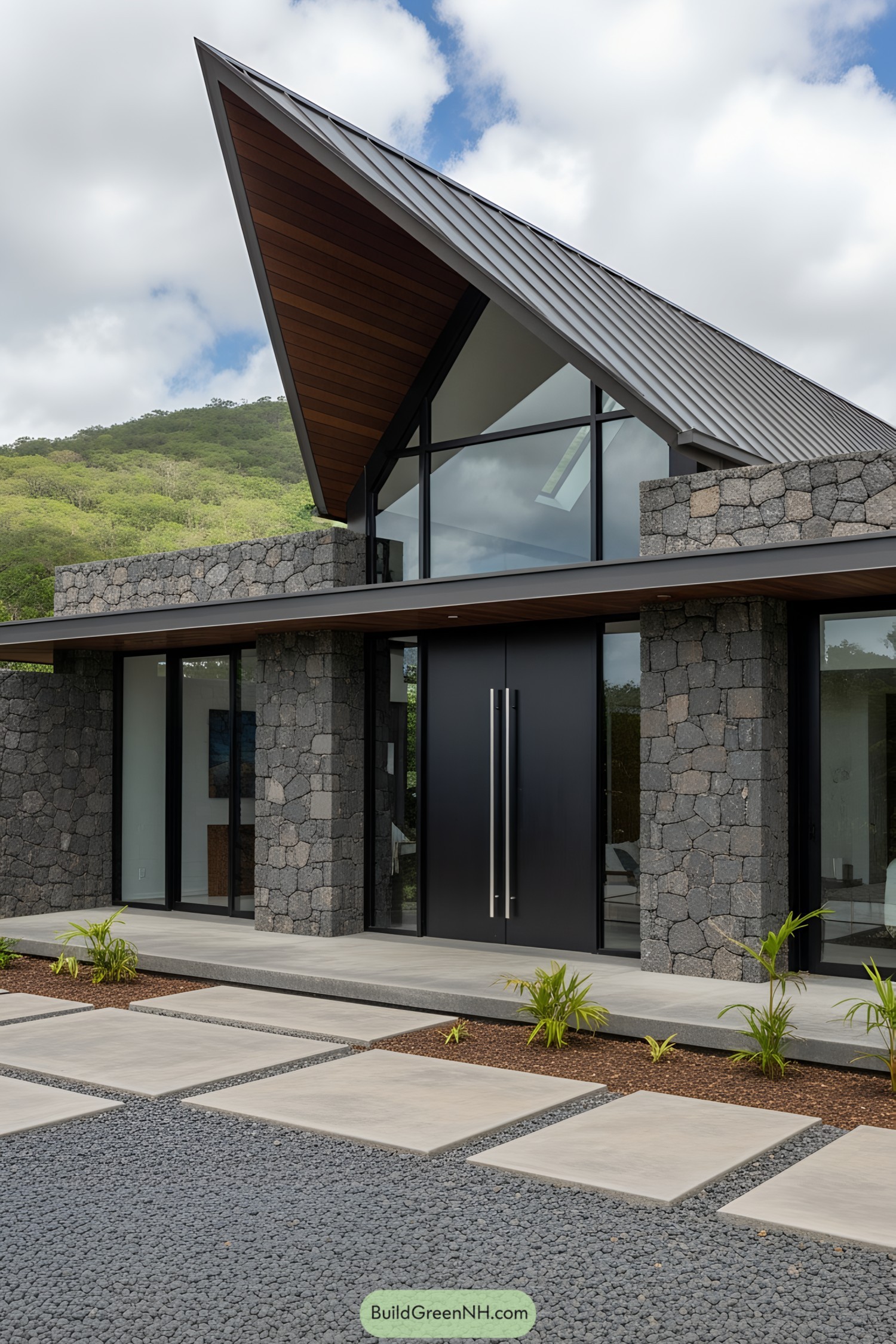 Modern house facade with volcanic stone and pointed roof