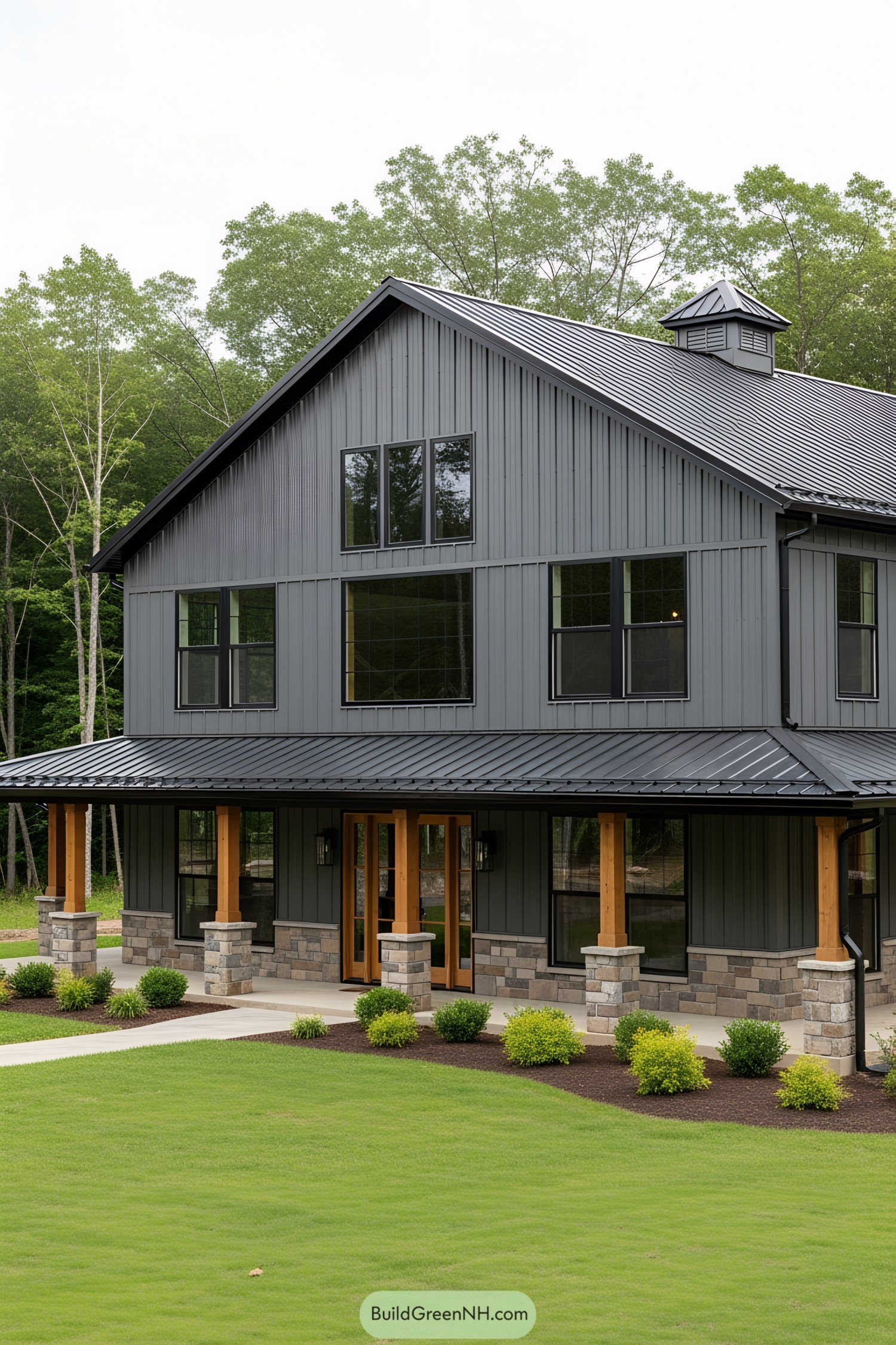 Modern two-story barndominium with metal siding and stone accents