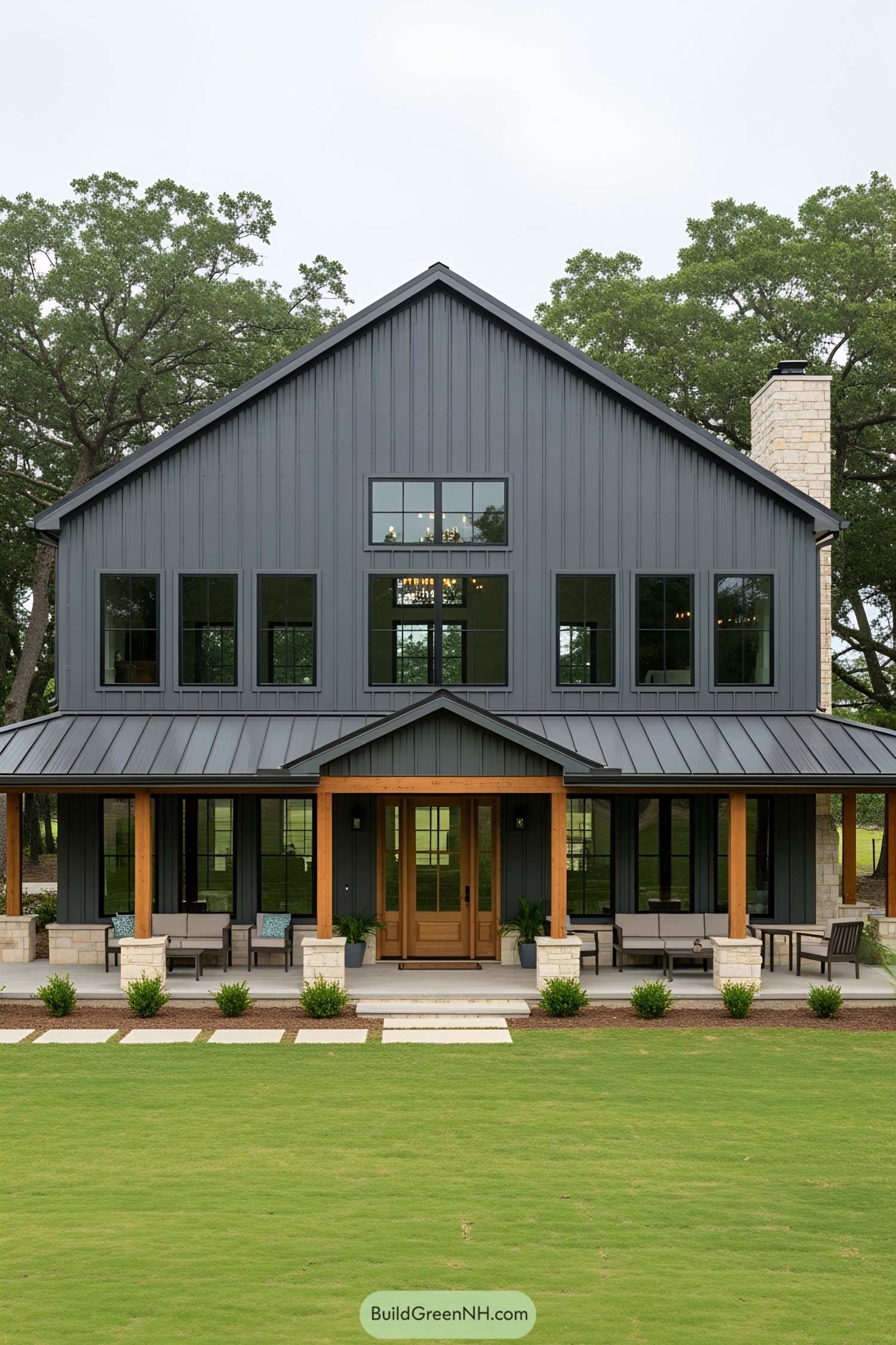 Two-story barndominium with wooden accents and large windows