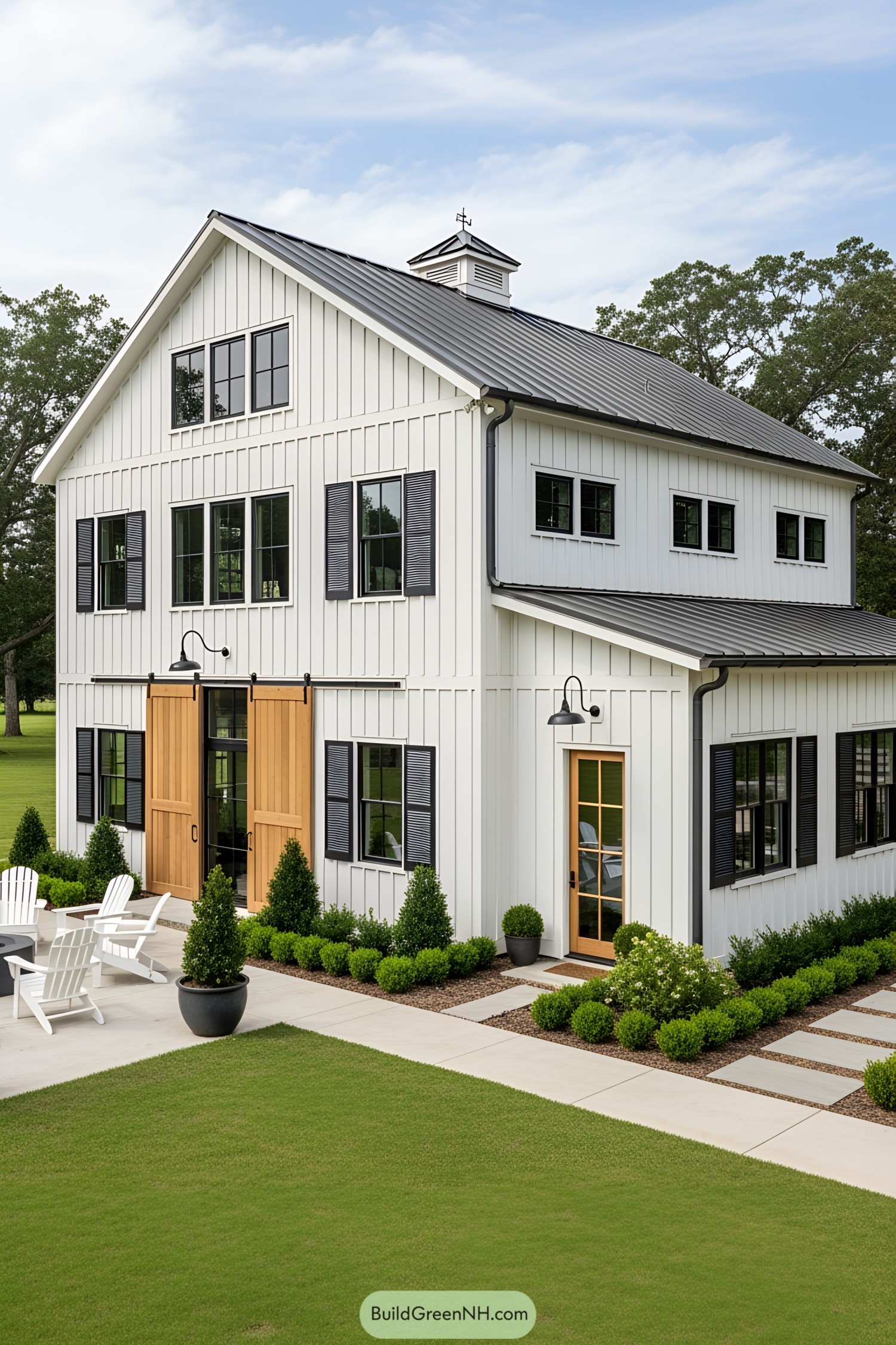 Charming two-story barndominium with large wooden doors