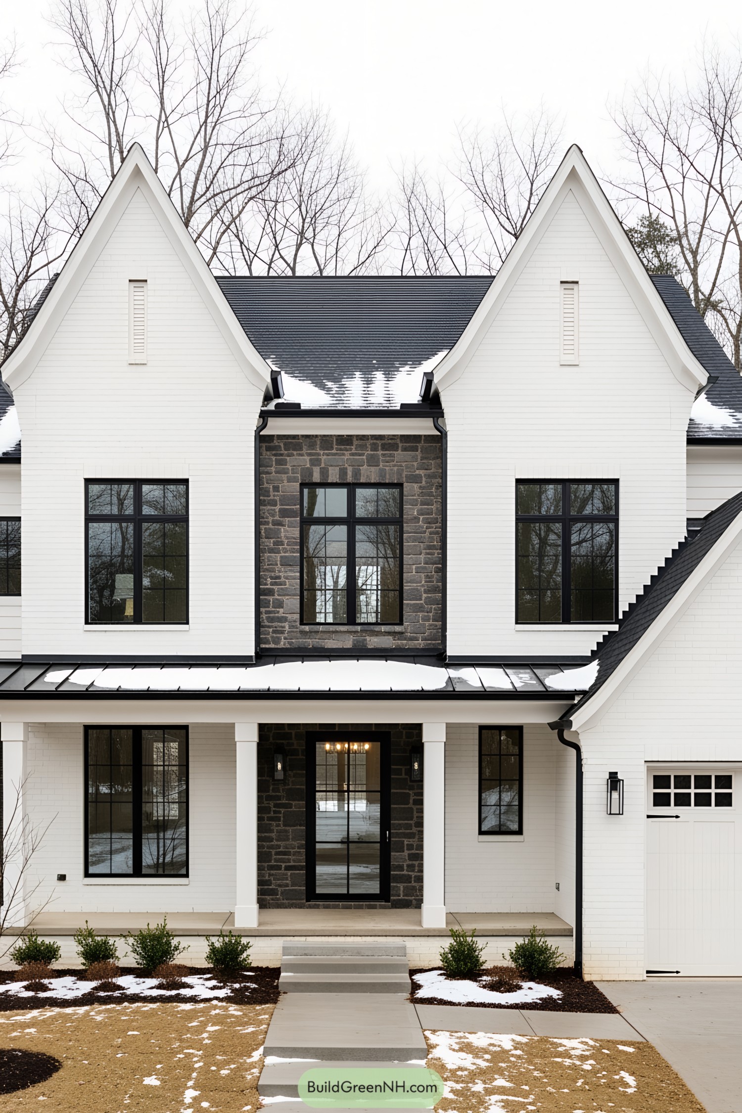 Classic white farmhouse with steep gabled roof