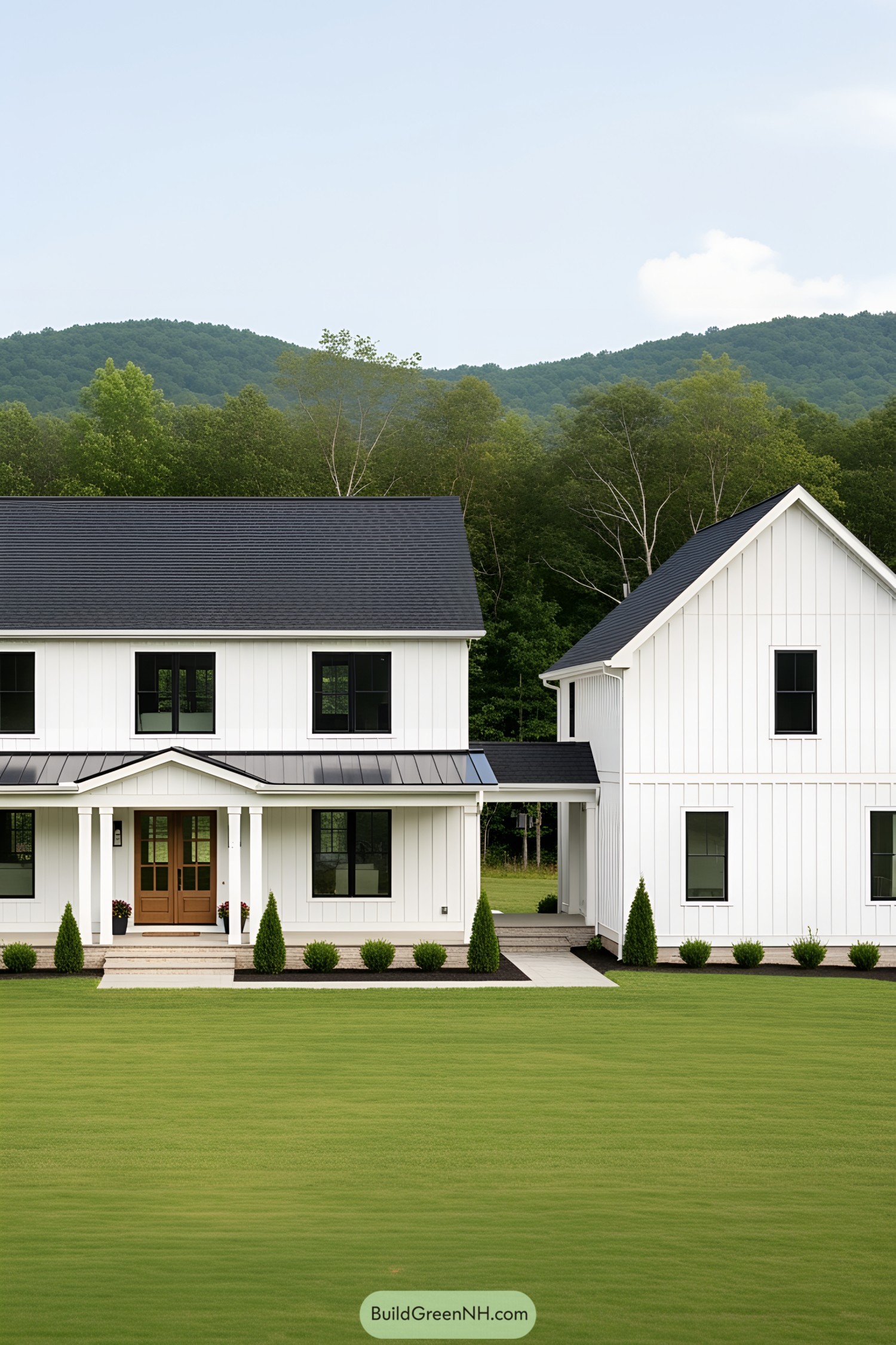 White farmhouse with black accents amidst greenery