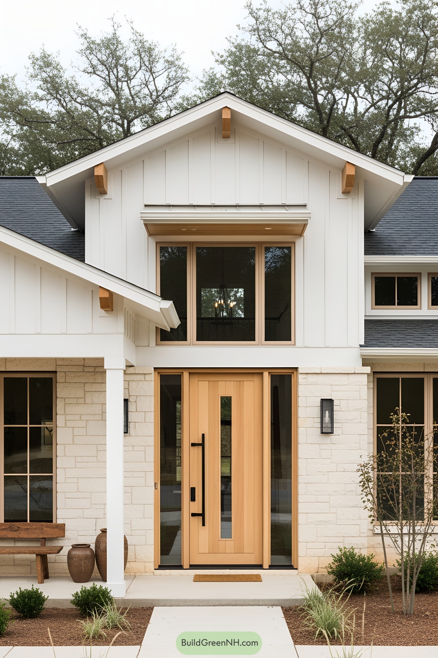 Front entrance of a modern white ranch house with wooden accents