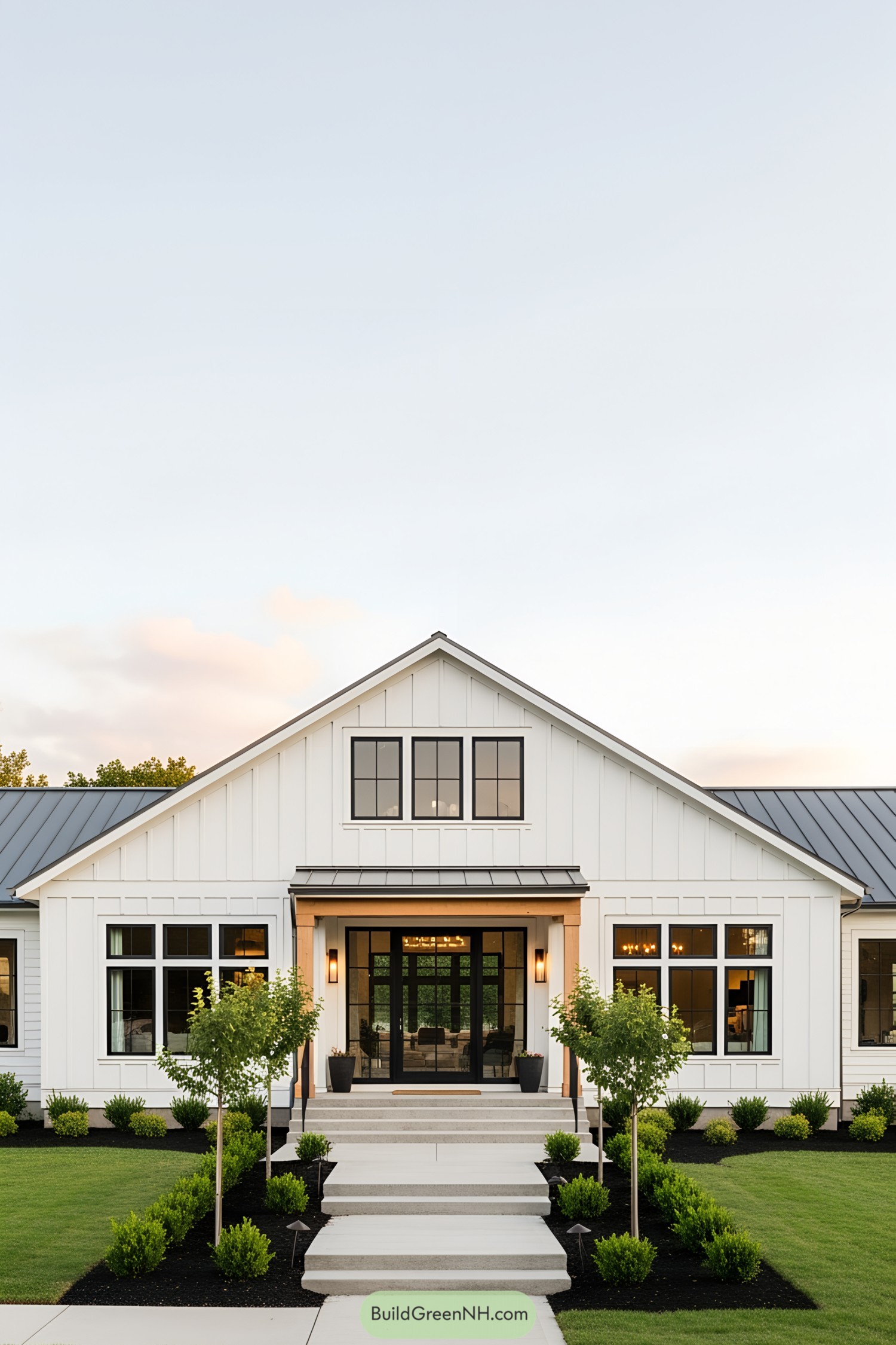 Contemporary white ranch house with manicured lawn