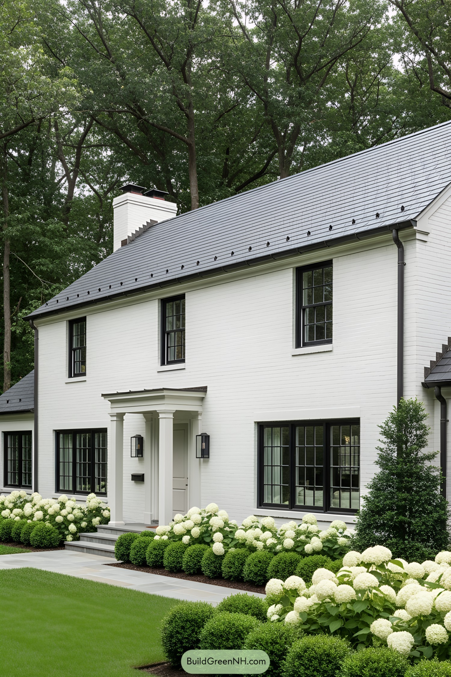 White house with lush green garden