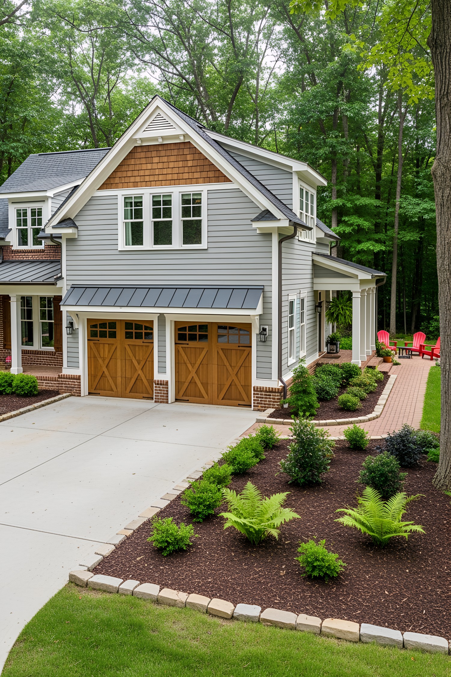 Gray cottage with a wooden double garage