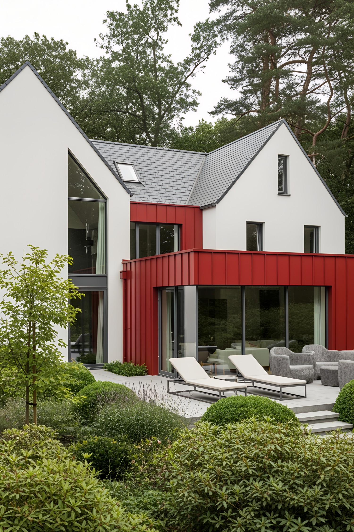 Modern cottage with red accents and lush greenery
