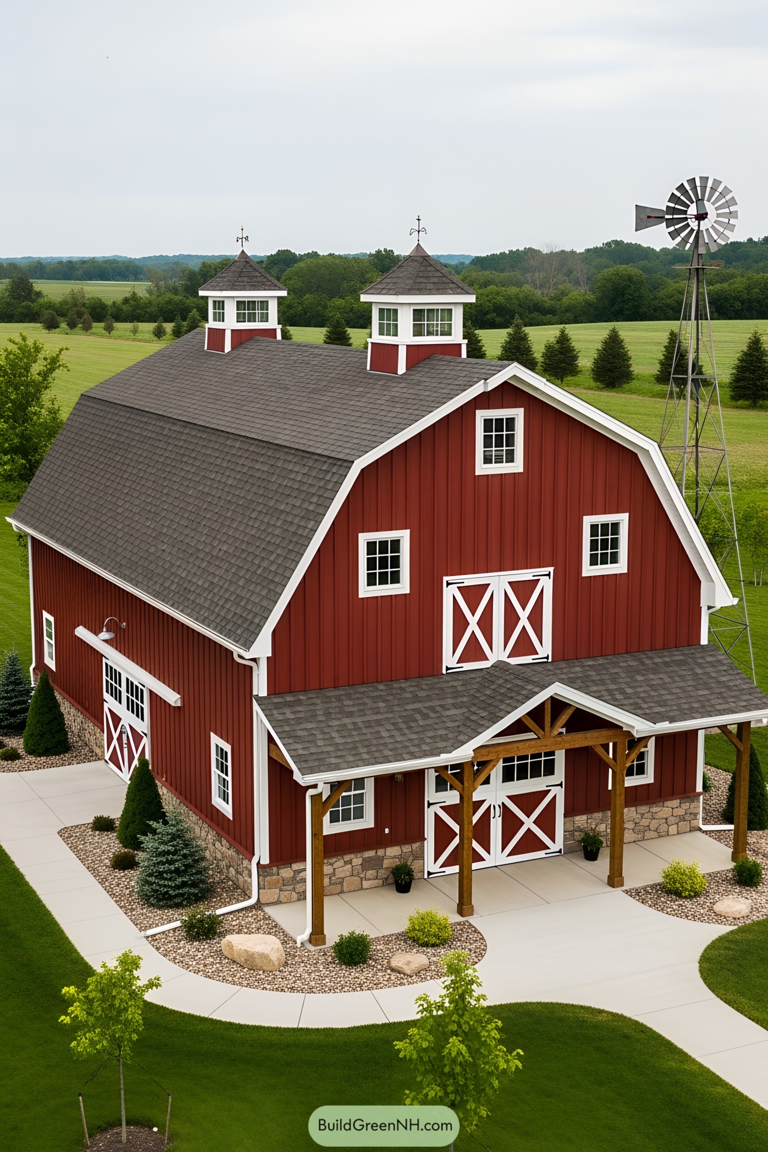 Red barn house with two cupolas and a windmill
