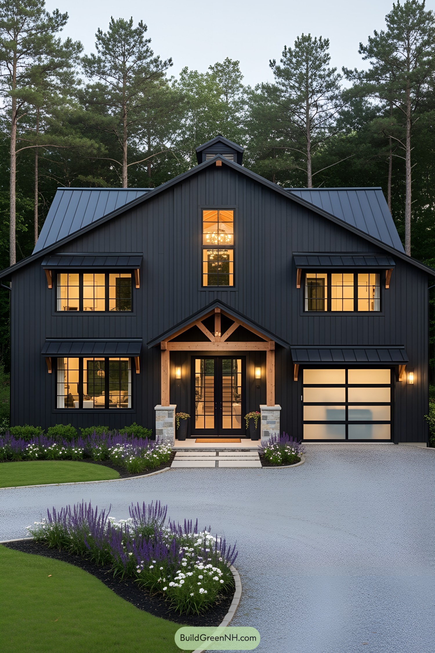 All-black barndominium with warm interior lights