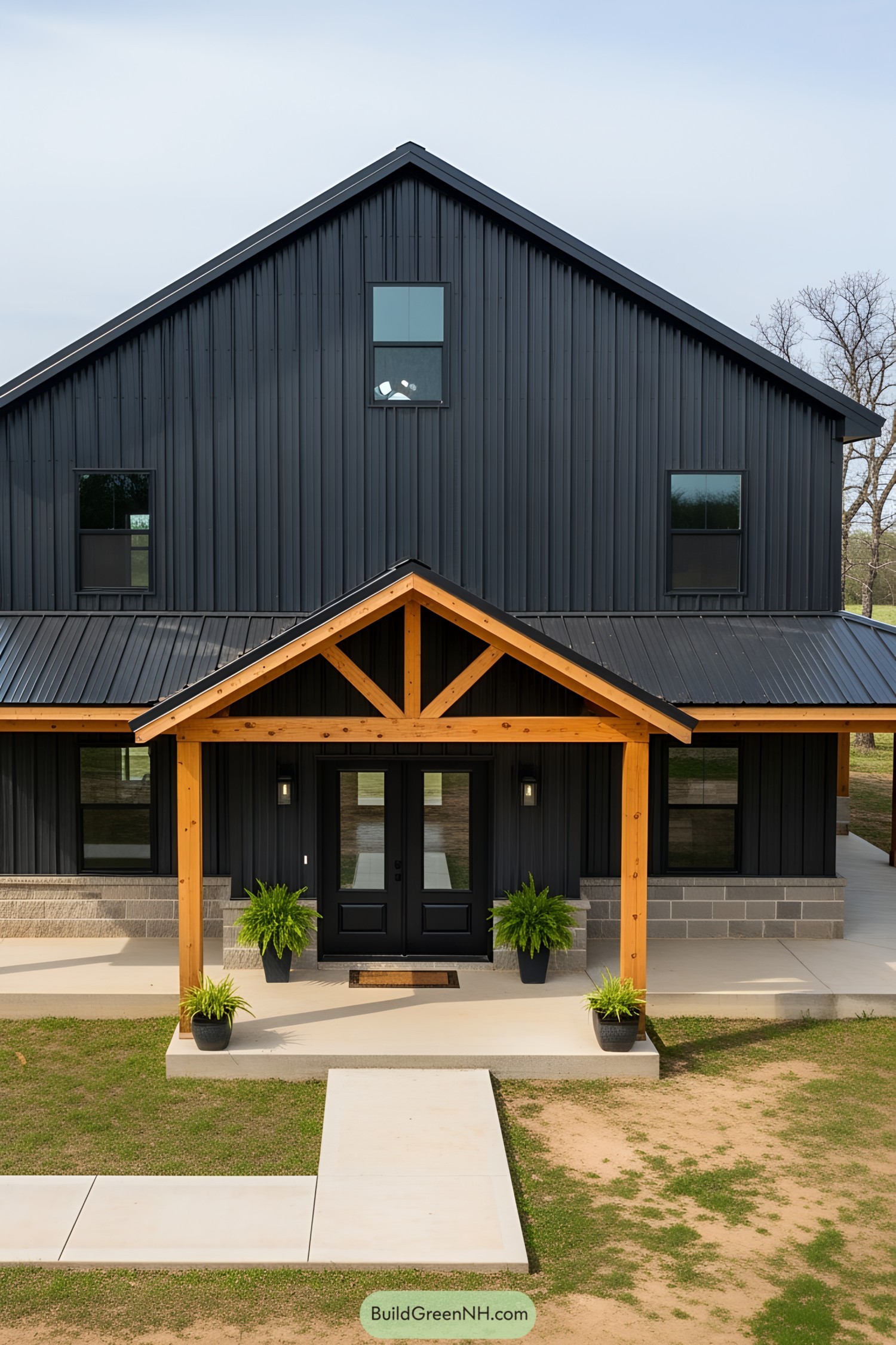 Black barndominium with wood accents
