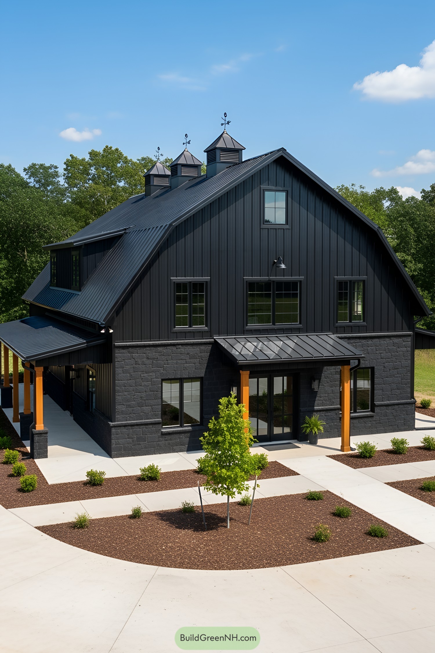 All-black barndominium with sleek design and manicured landscaping