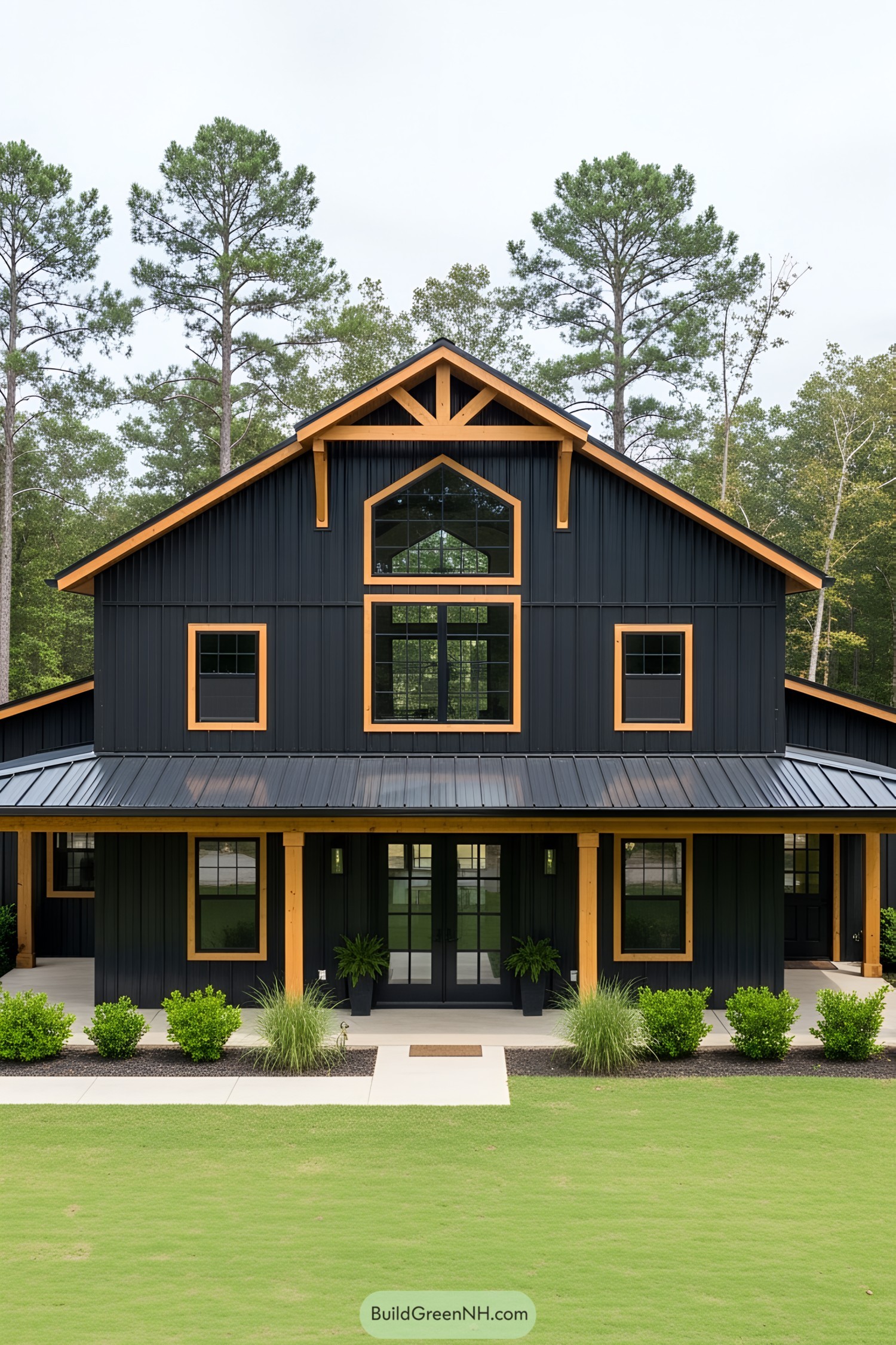 Sleek black barndominium with wooden accents and lush greenery