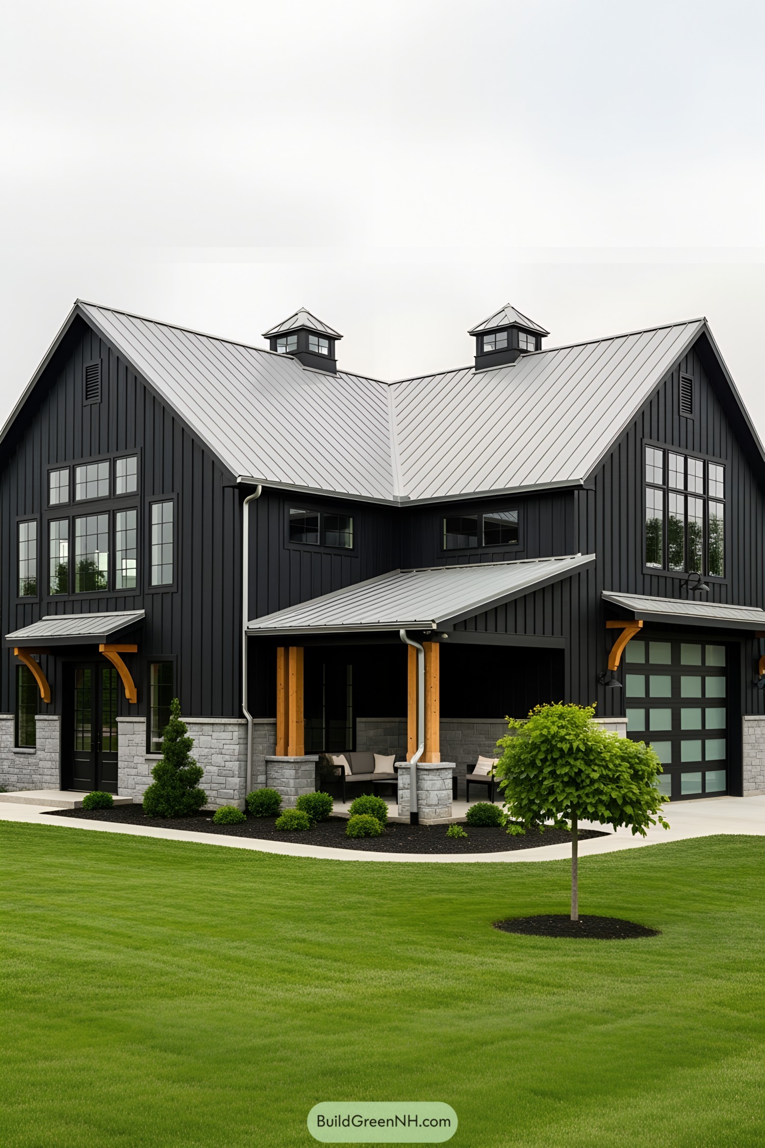 All-black barndominium with metal roof and modern design