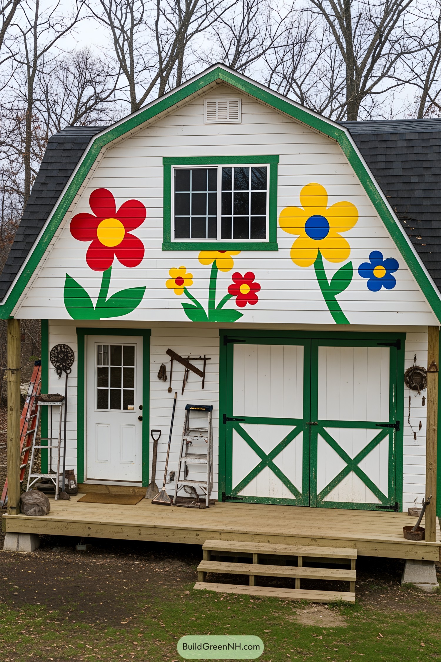 White shed with colorful flower murals and green accents