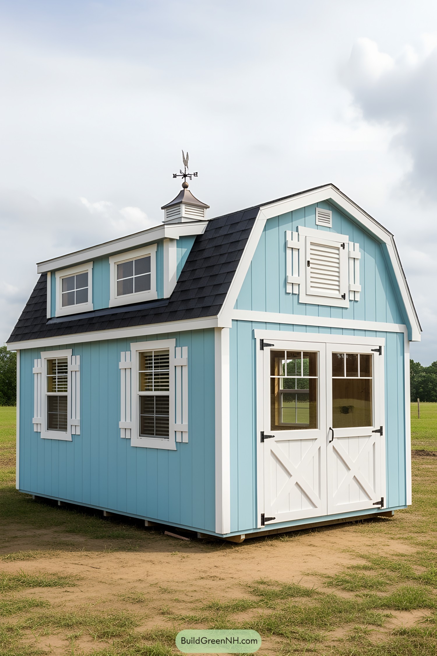 Blue barn-style tiny house with white accents