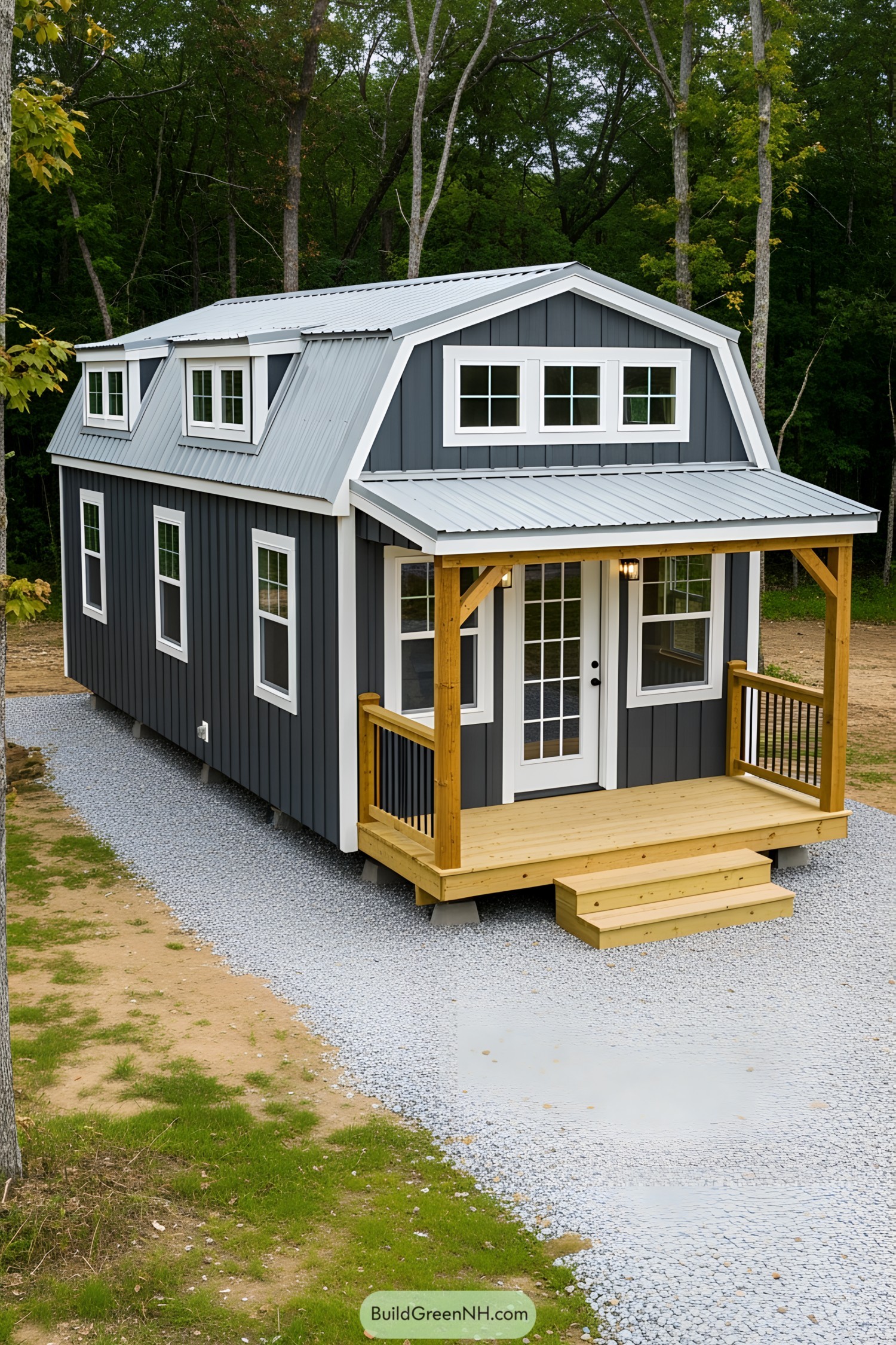 Small dark blue barn-style house with a cozy porch