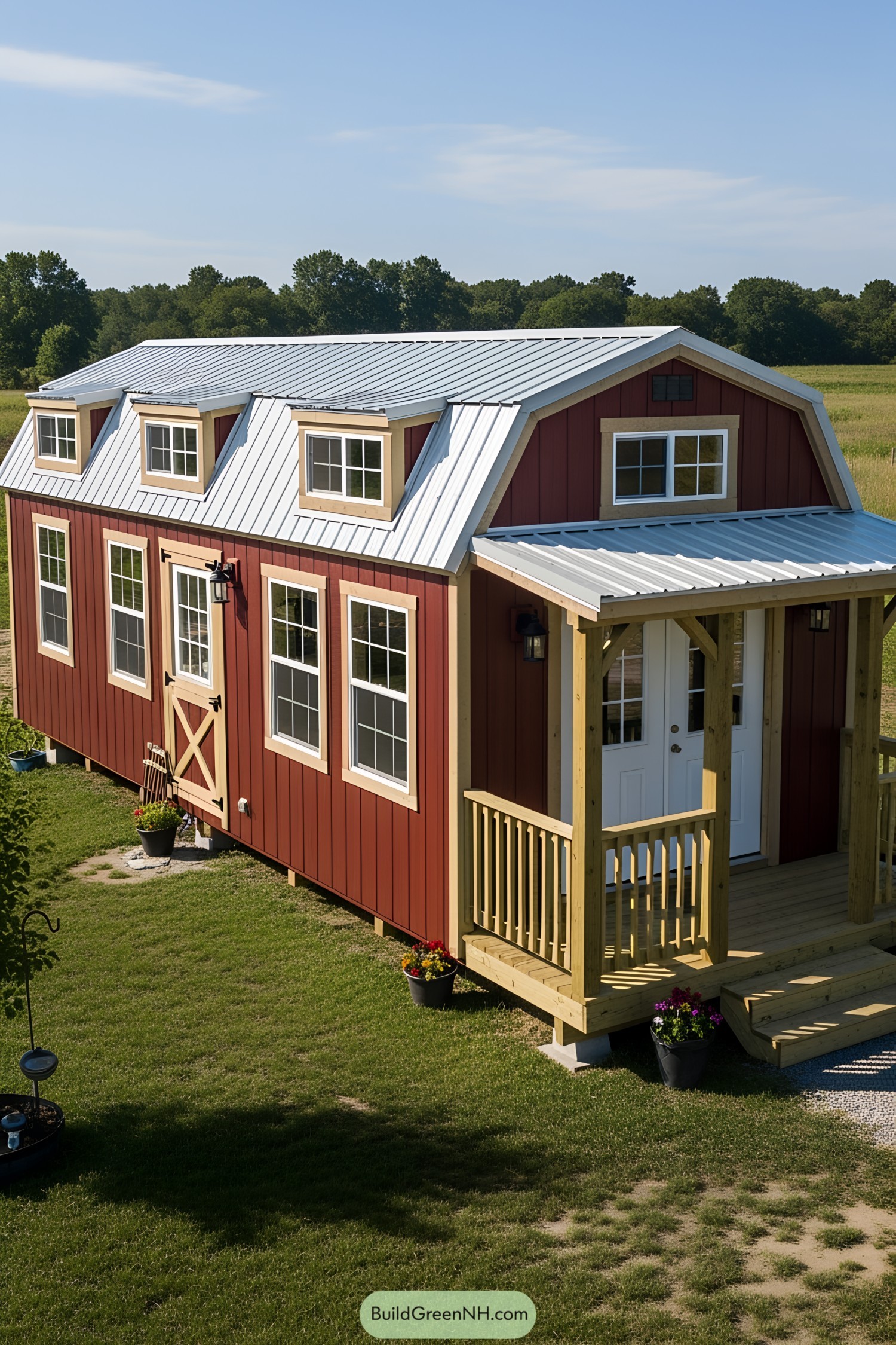 Red barn-style tiny house with white trim and a porch
