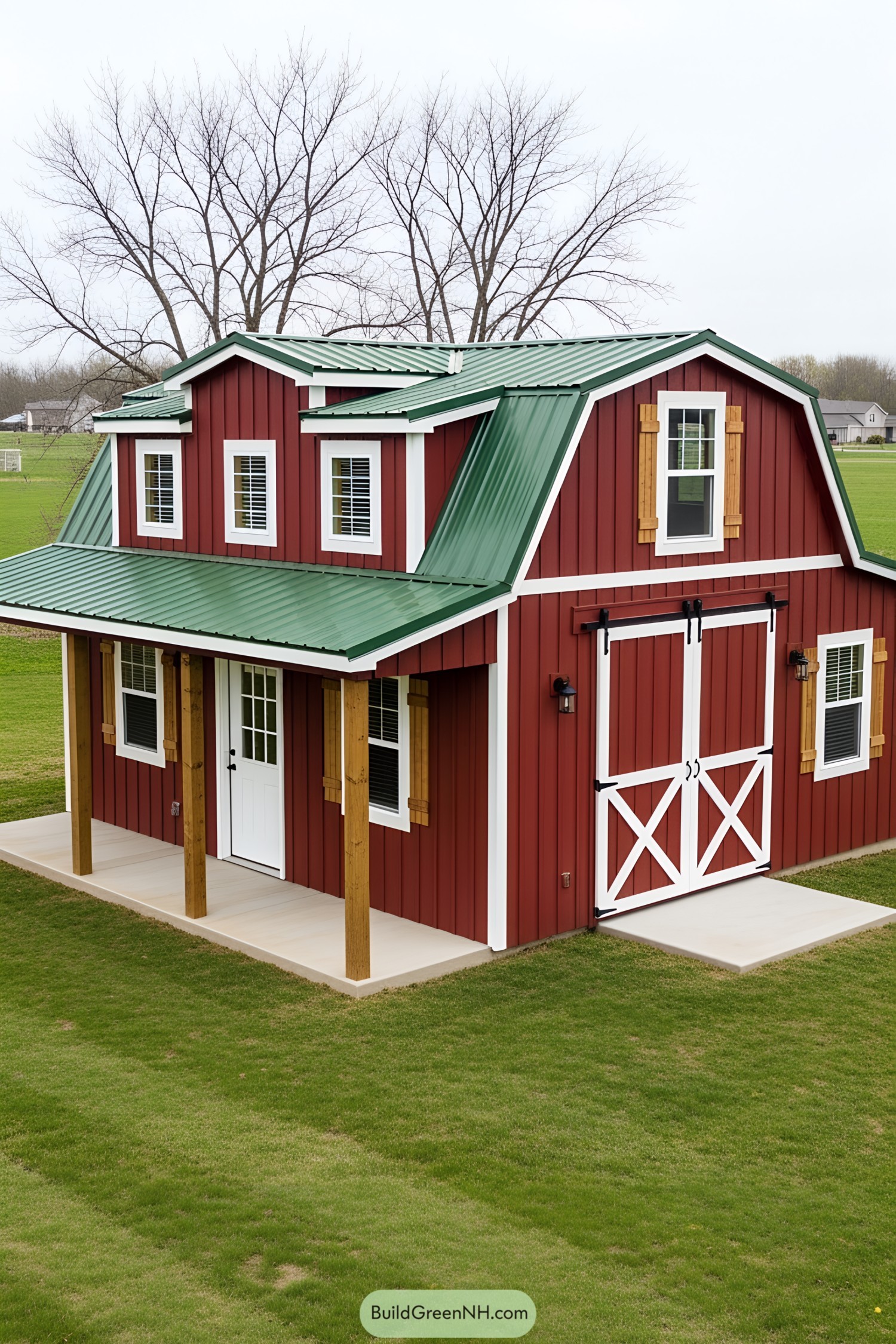 Red barn-themed tiny house with green roof on grassy lawn