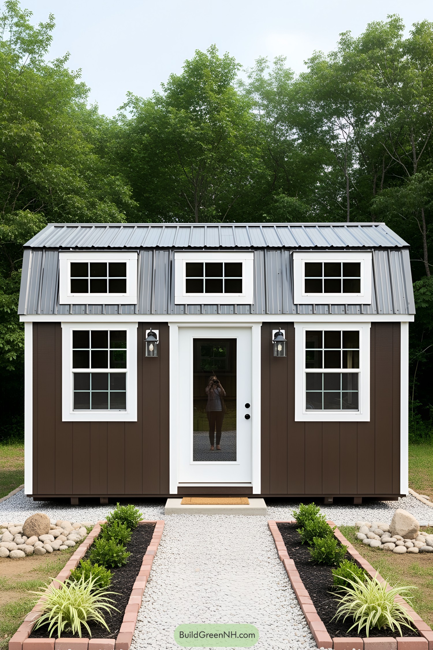 Tiny brown barn shed with a metal roof