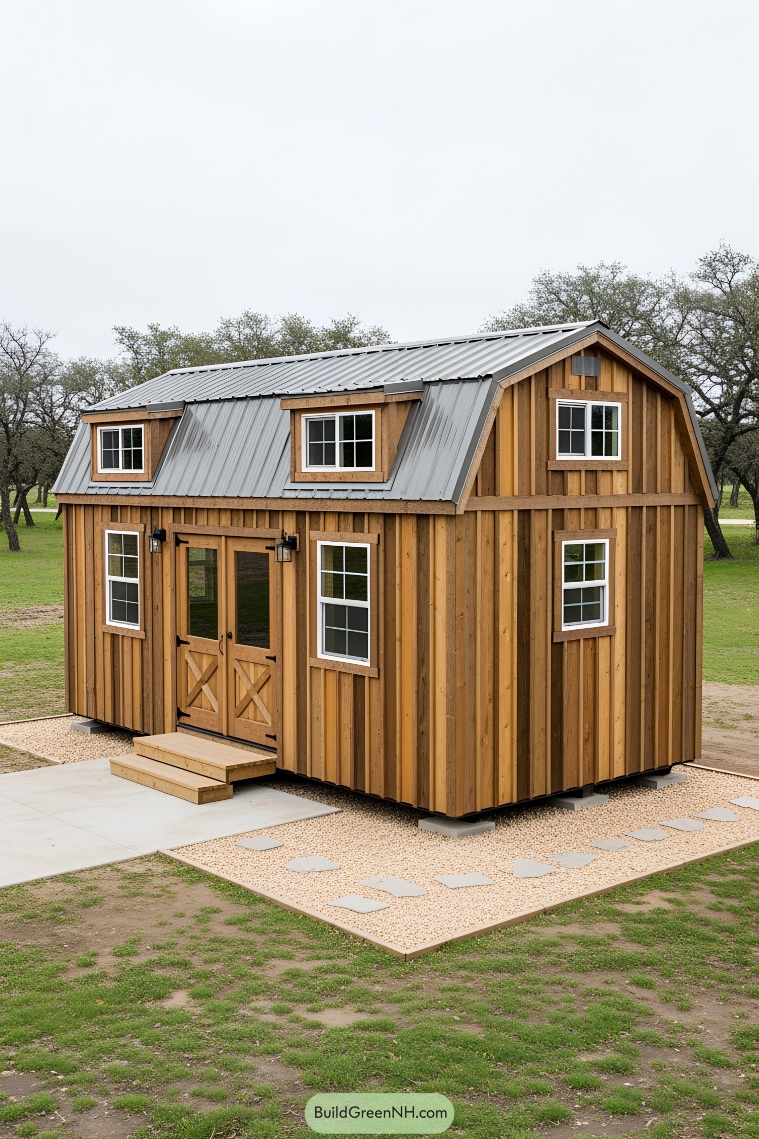 Compact wooden barn-style tiny house on grassy yard