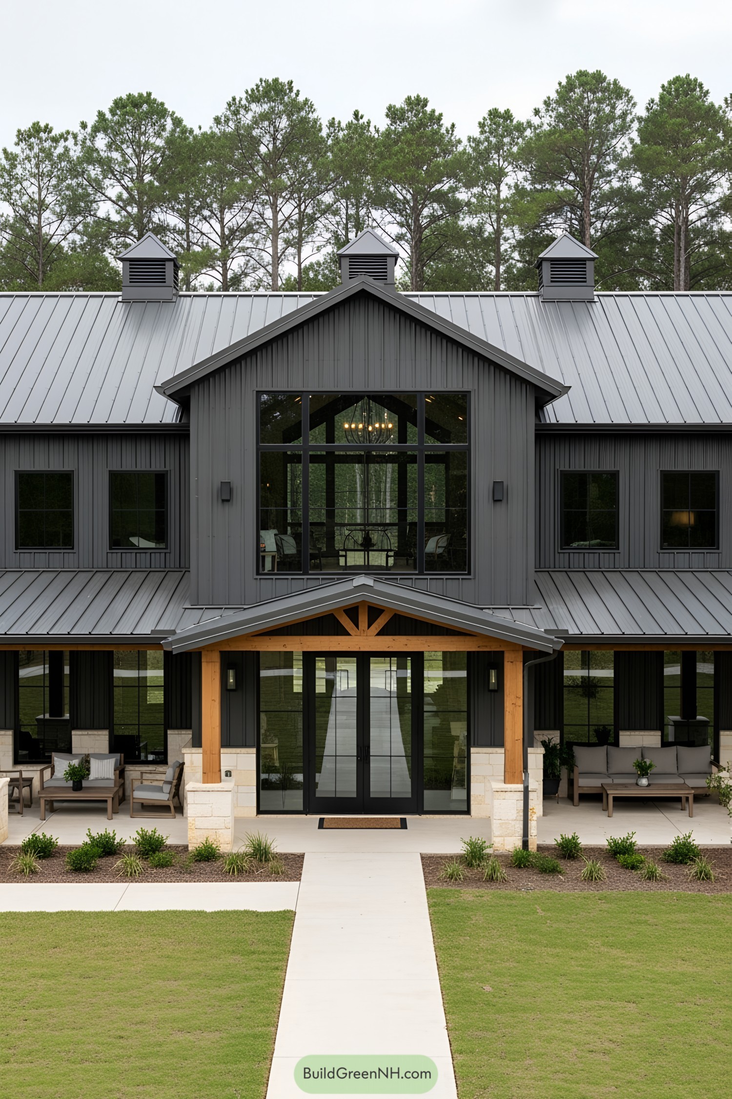 Sleek barndominium with large windows