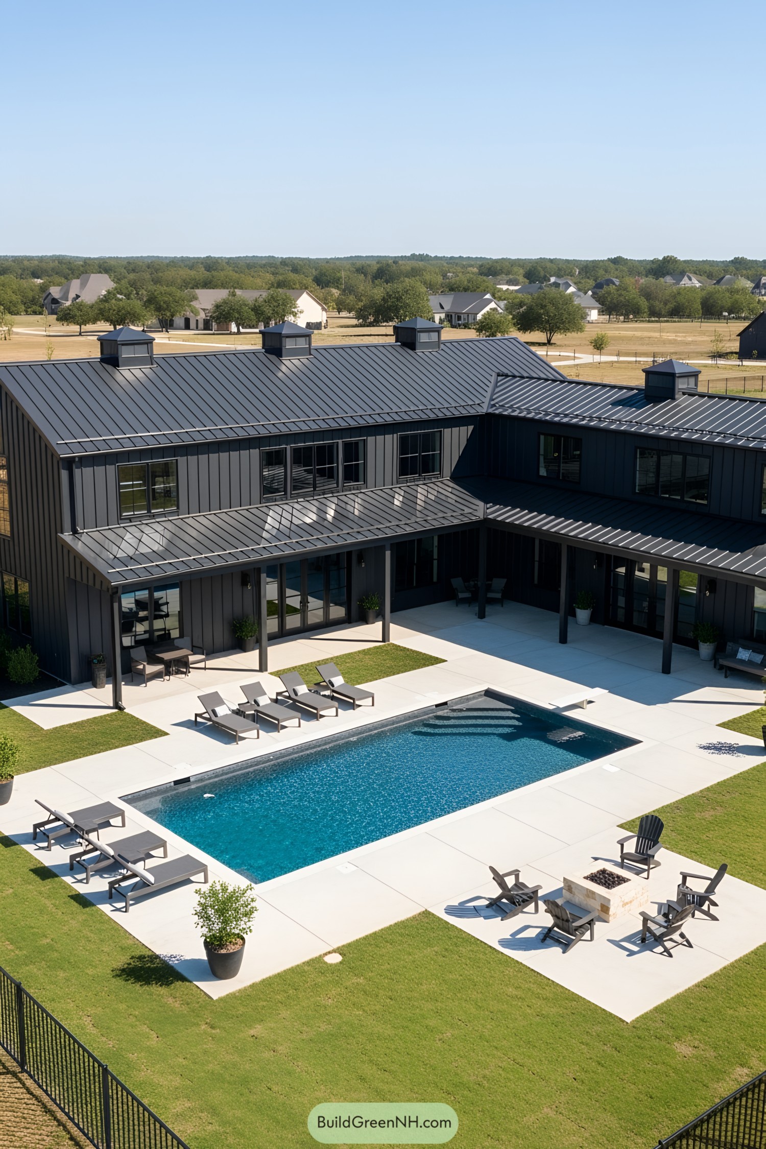 Modern barn with pool and patio lounge