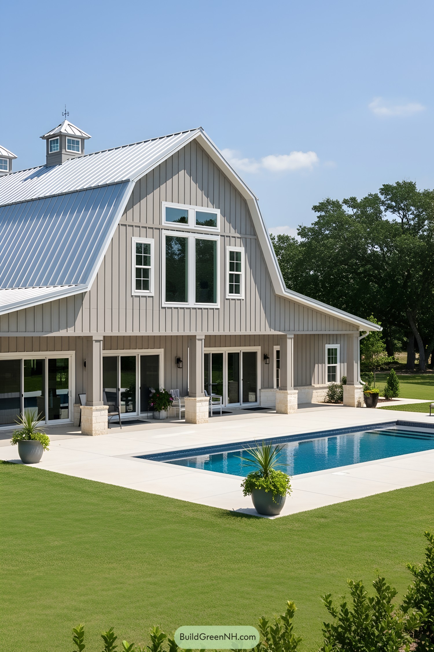 Barndominium with a pool and greenery