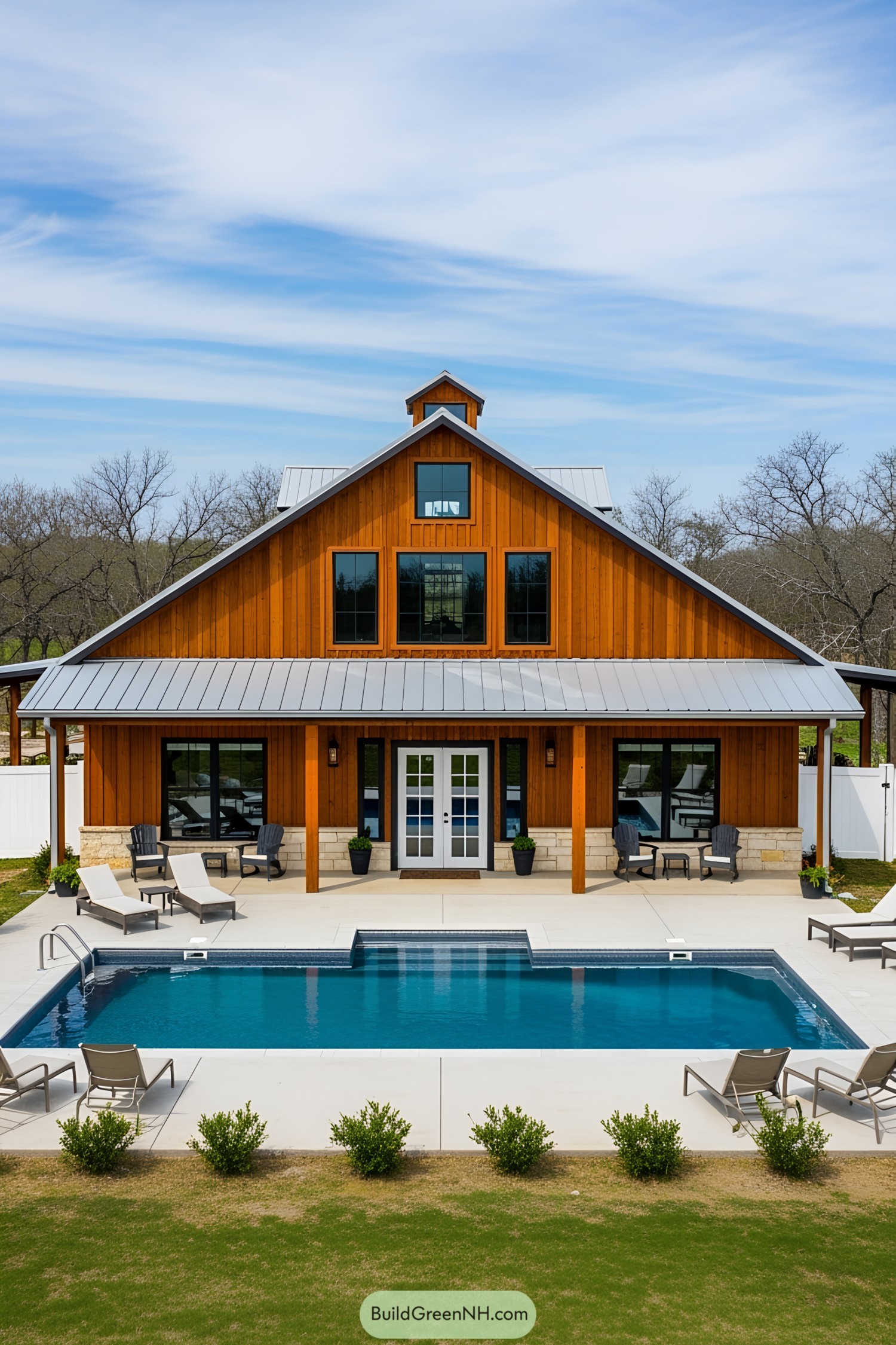 A cozy barn with a modern pool
