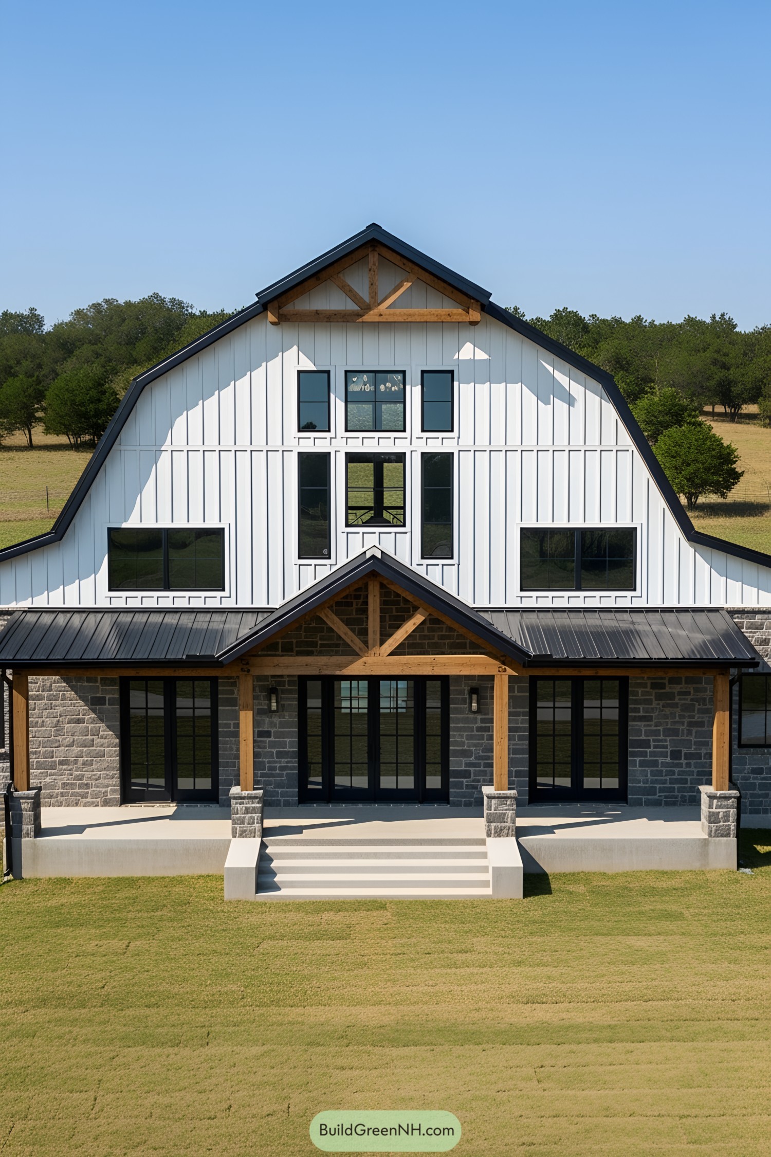 Chic barndominium with stone accents and wide lawn