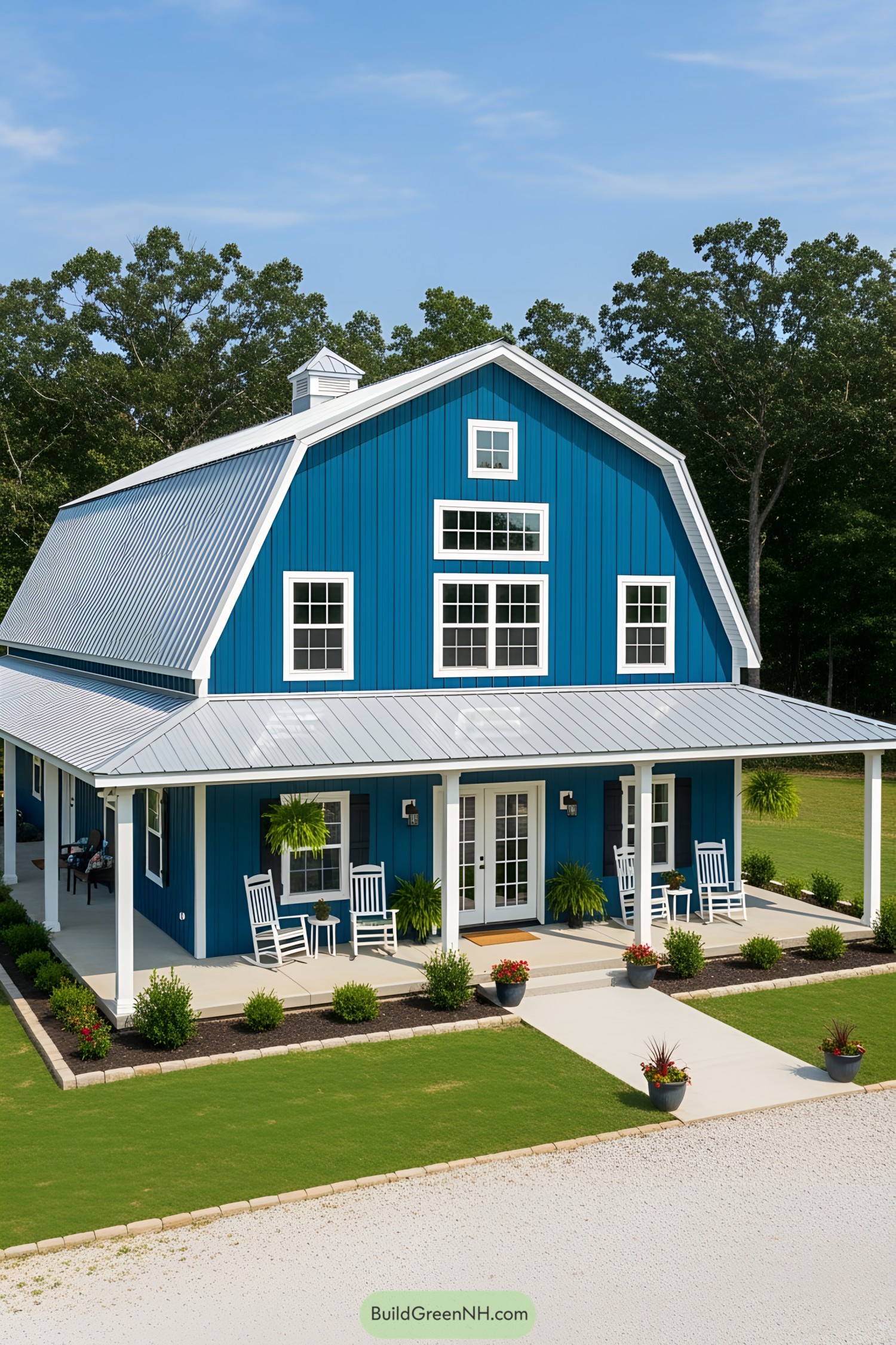 Blue barndominium with white accents and porch