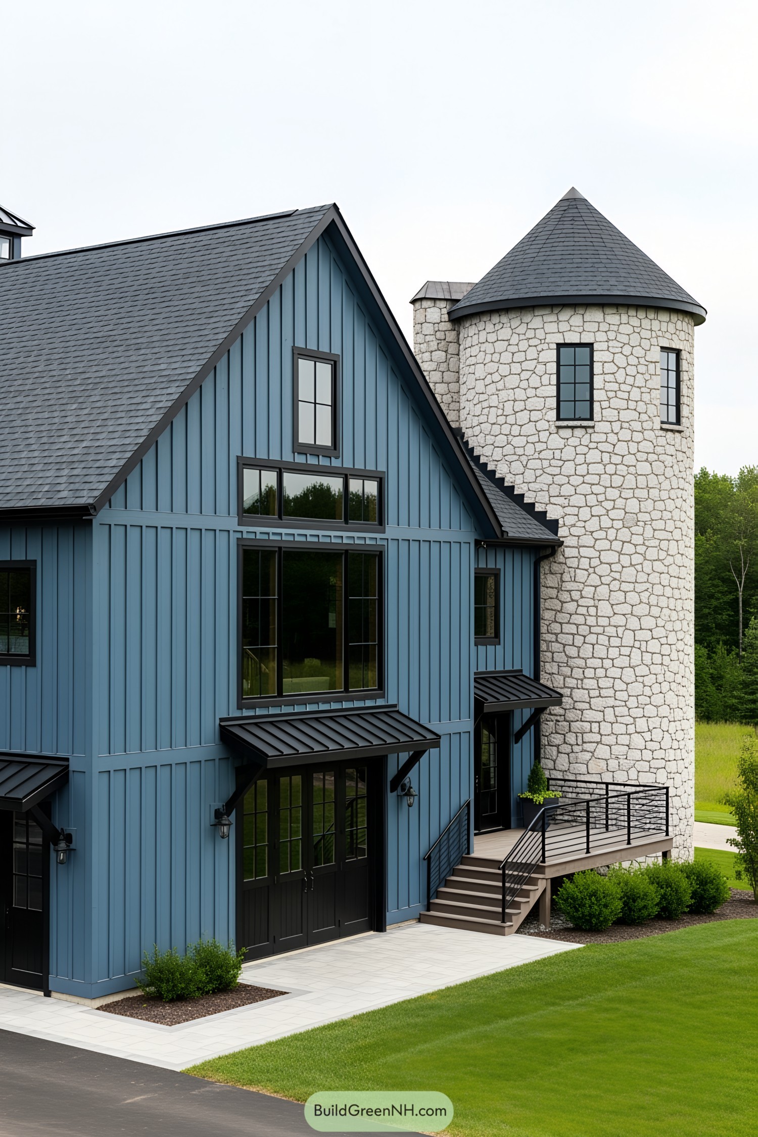 Blue barndominium with a stone turret