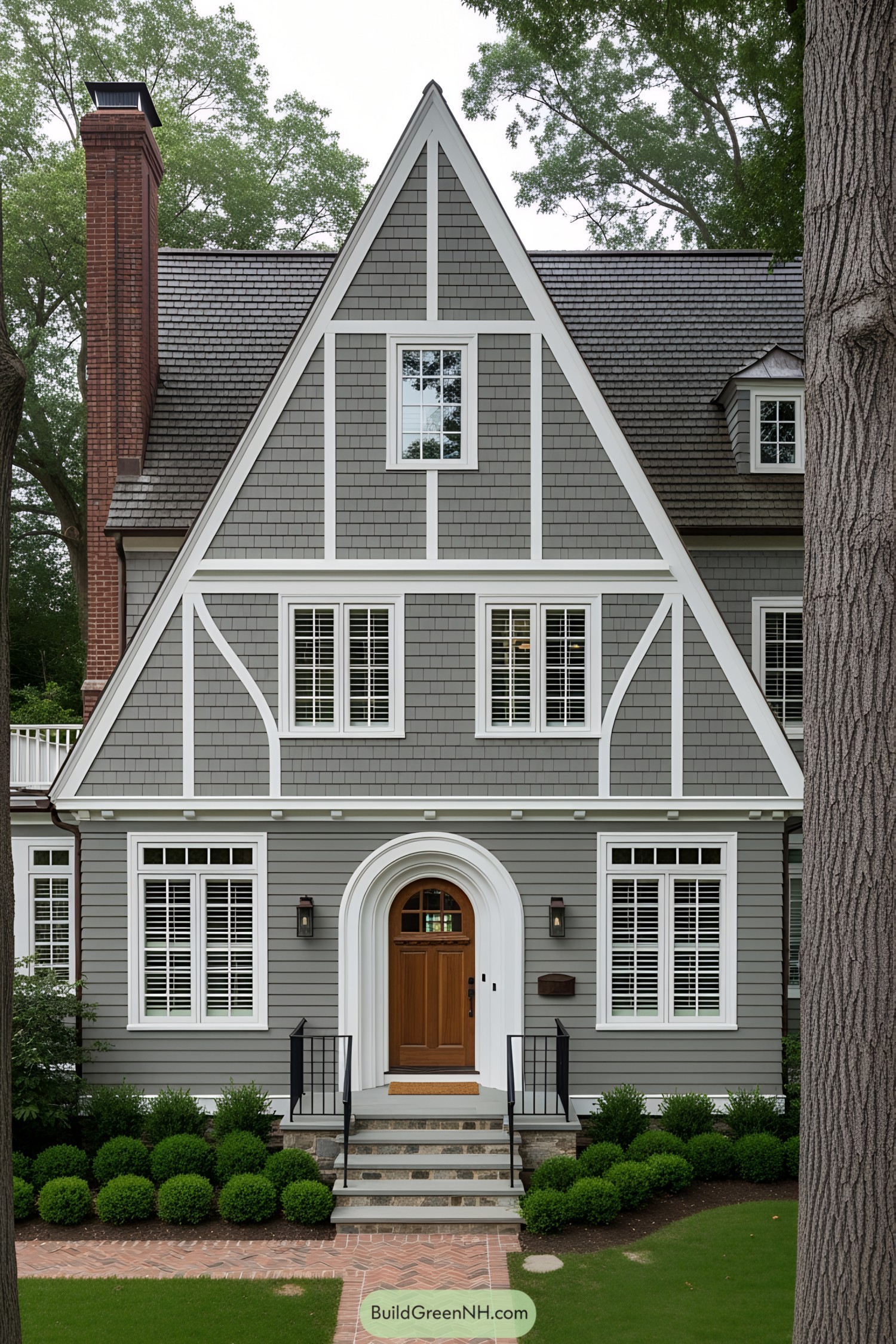 Charming house with a tall brick chimney and A-frame roof