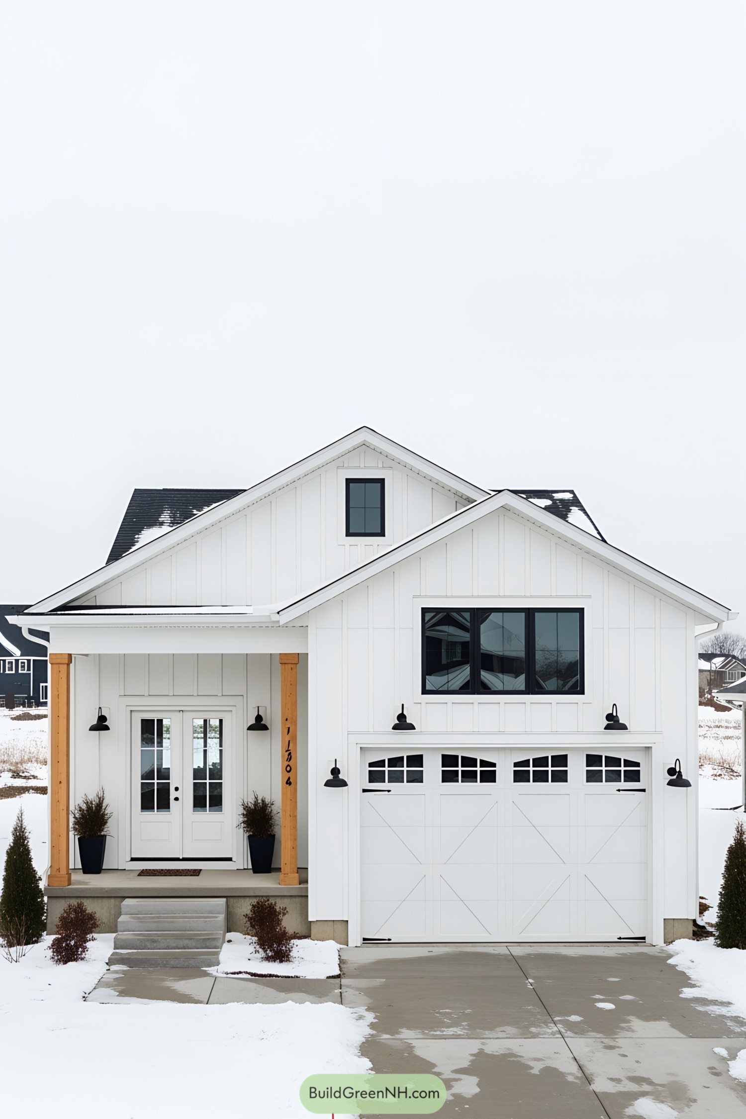 White bungalow farmhouse with modern features in a snowy setting