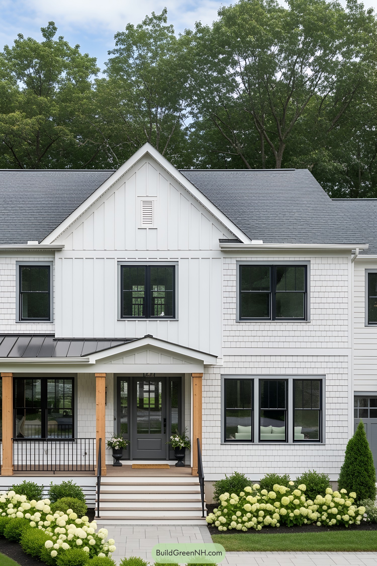 Modern white farmhouse facade with black accents