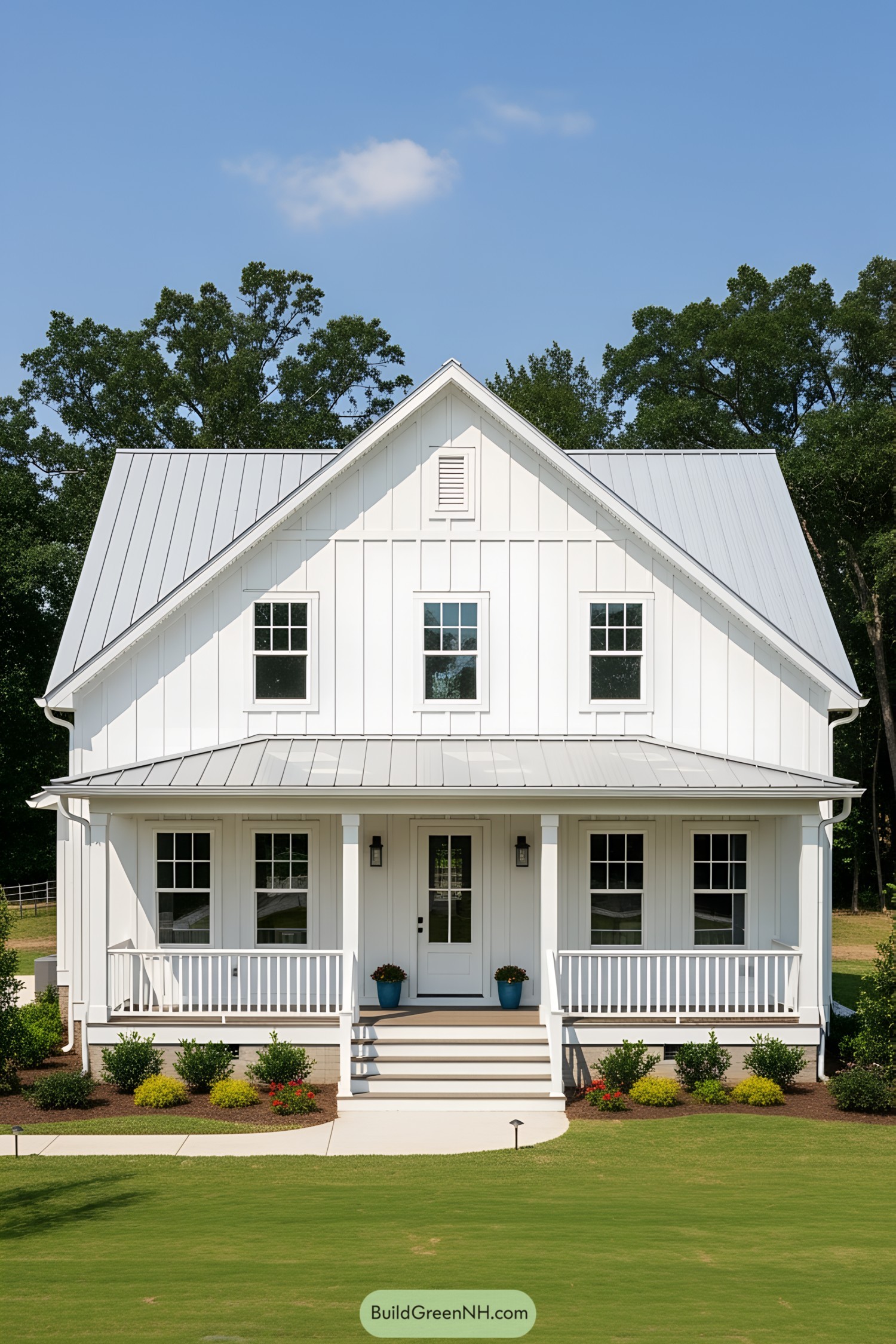 Classic white bungalow with a metal roof and cozy porch