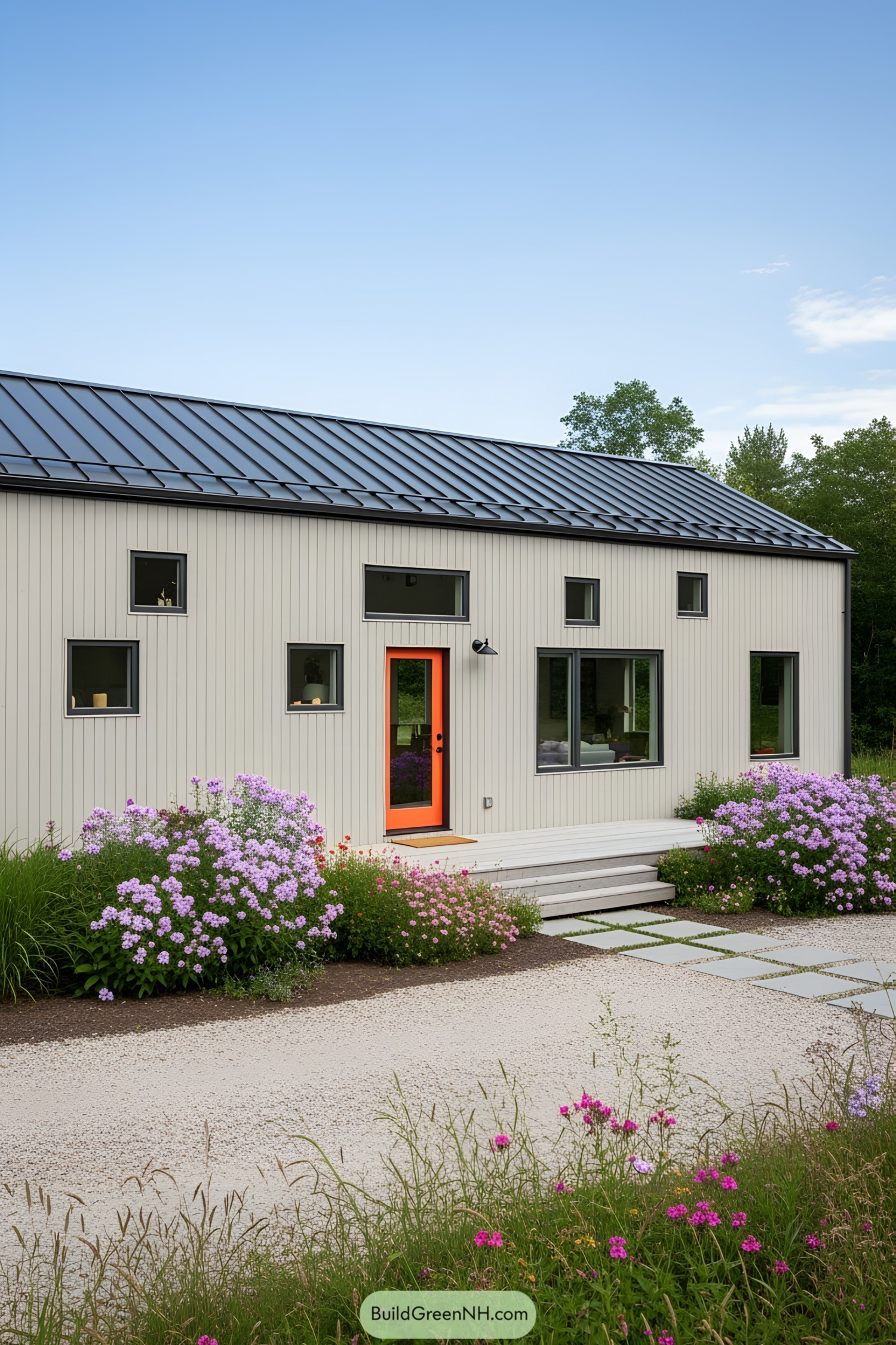 Small modern home with vibrant garden and open deck