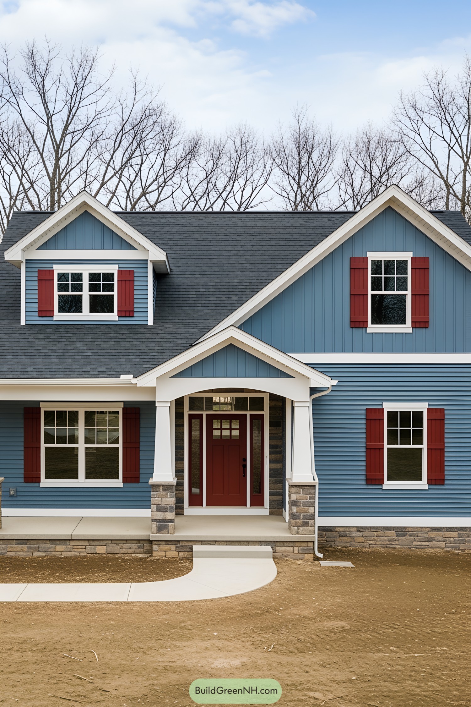 Blue cottage ranch house with red shutters and a porch