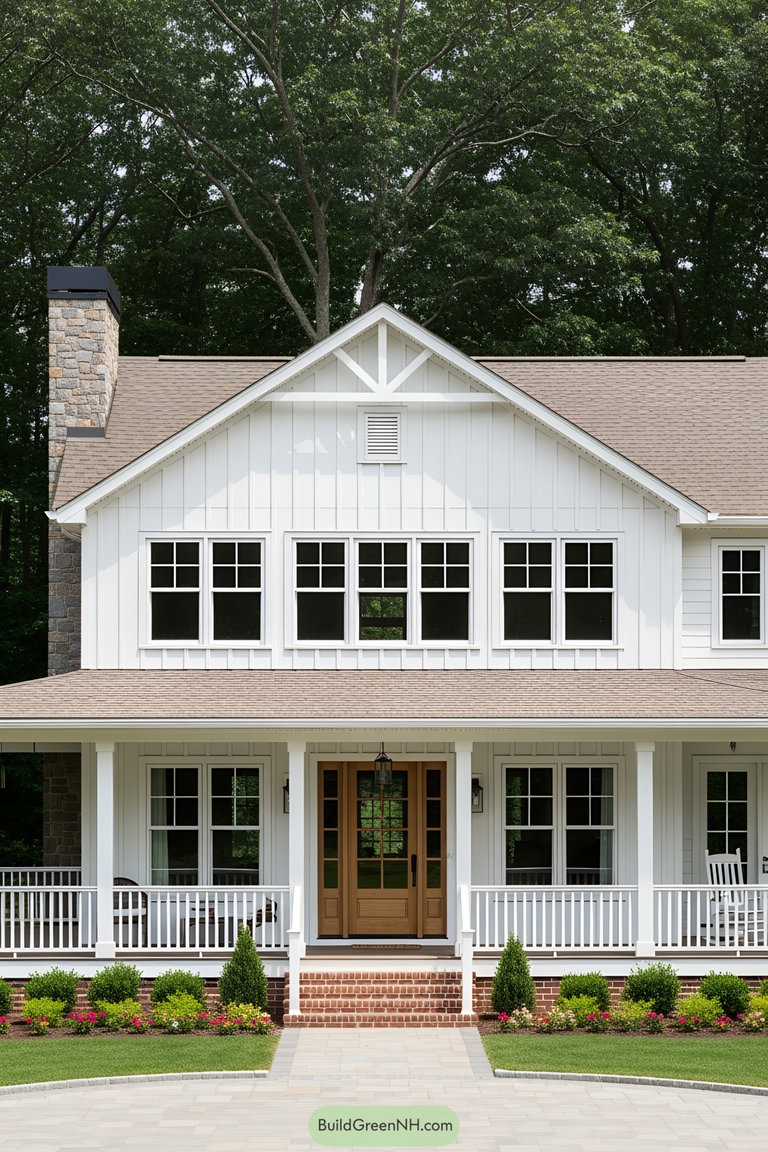 White cottage ranch with large windows and a front porch