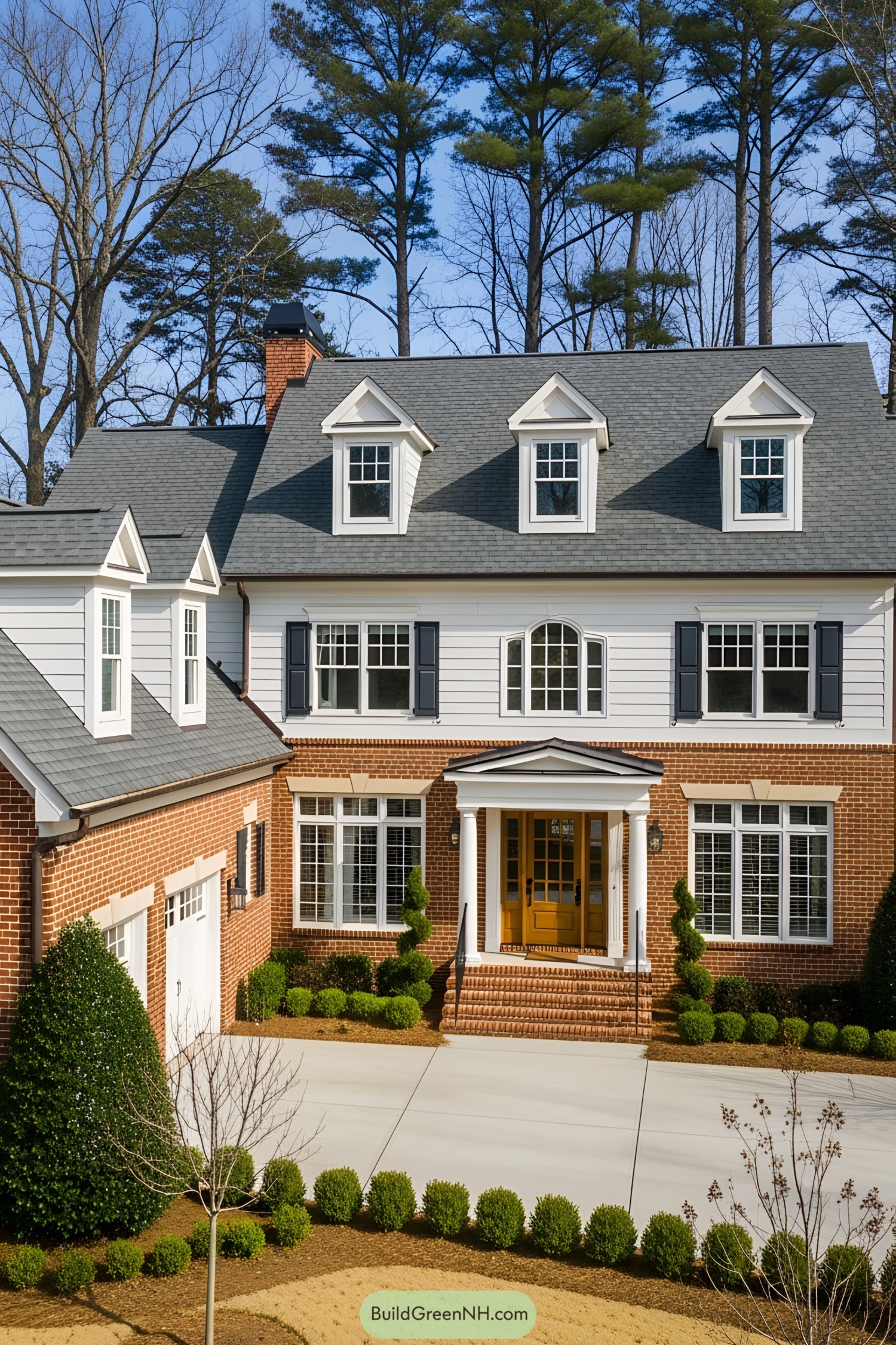 Charming two-story suburban house with a brick and white siding exterior
