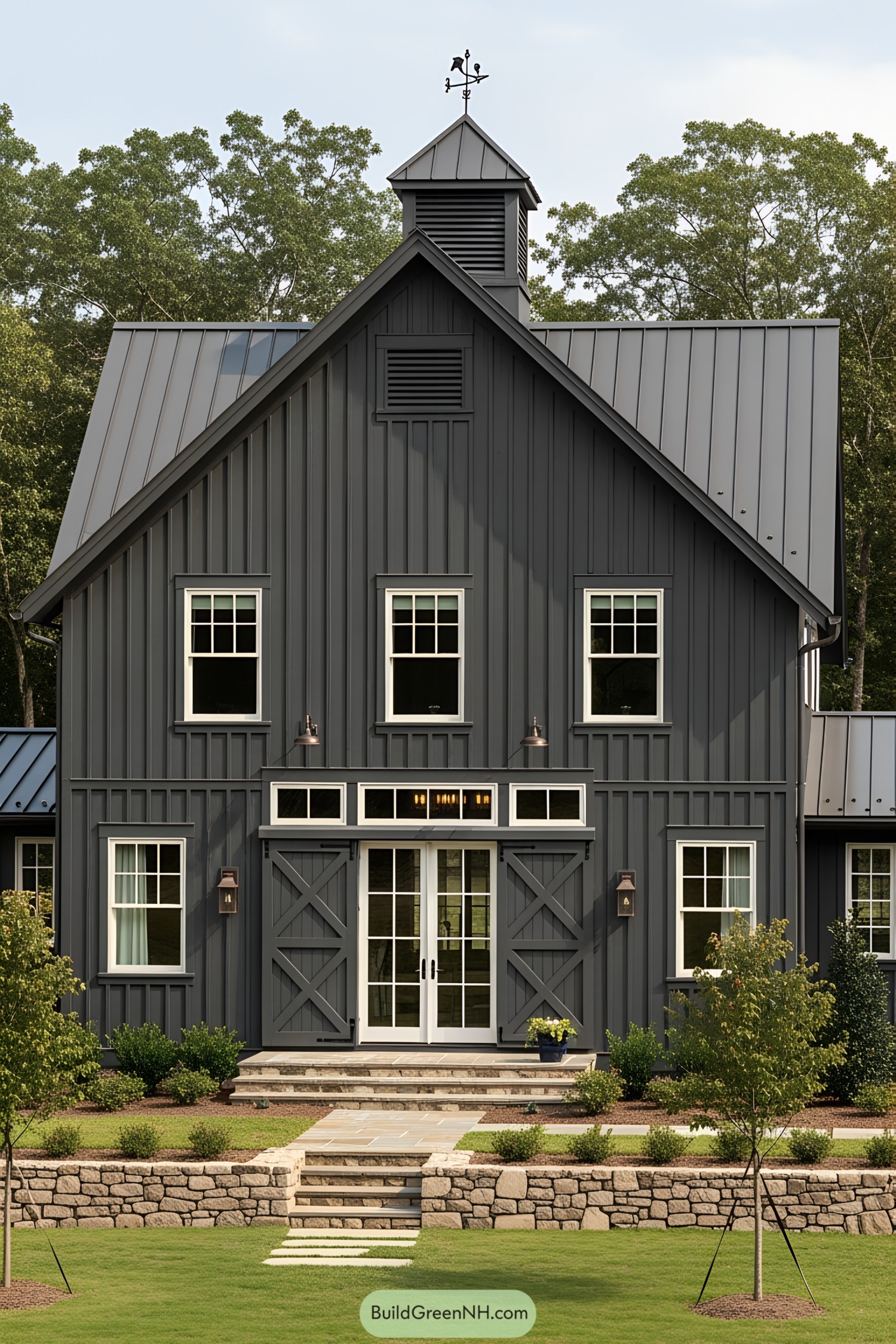 Dark gray barn house with white-framed windows