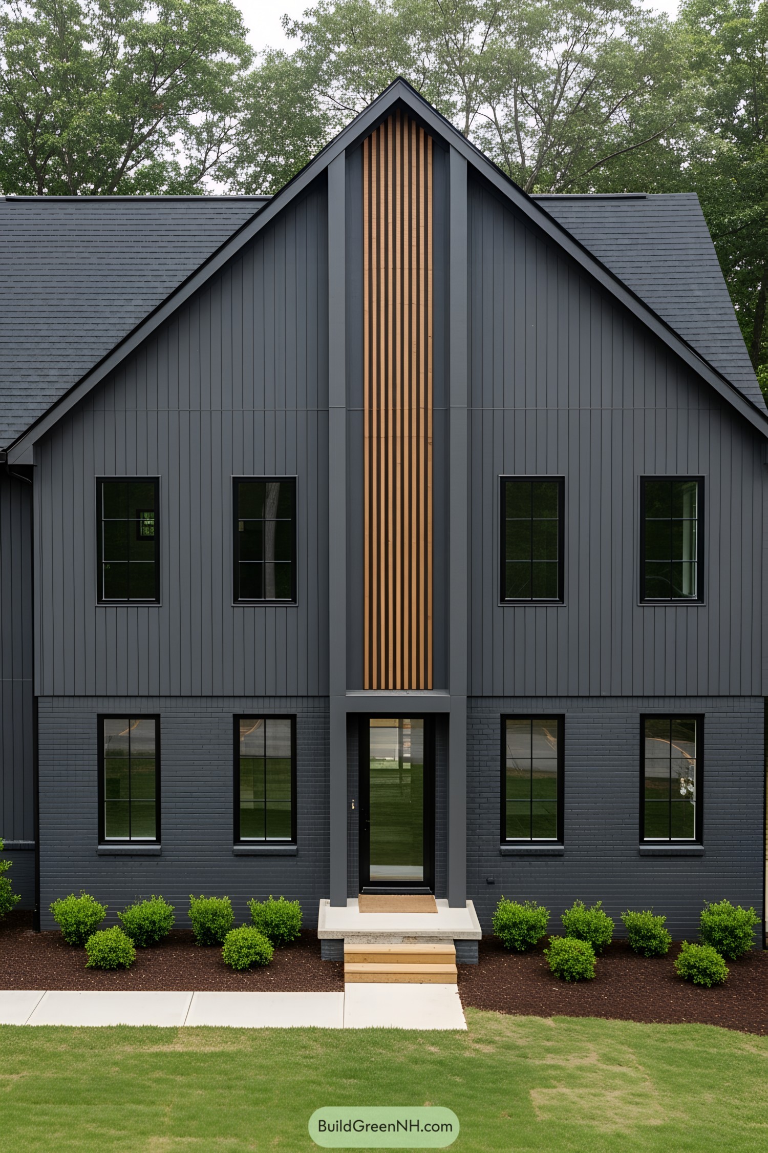Dark gray barn house with wooden accents and modern windows