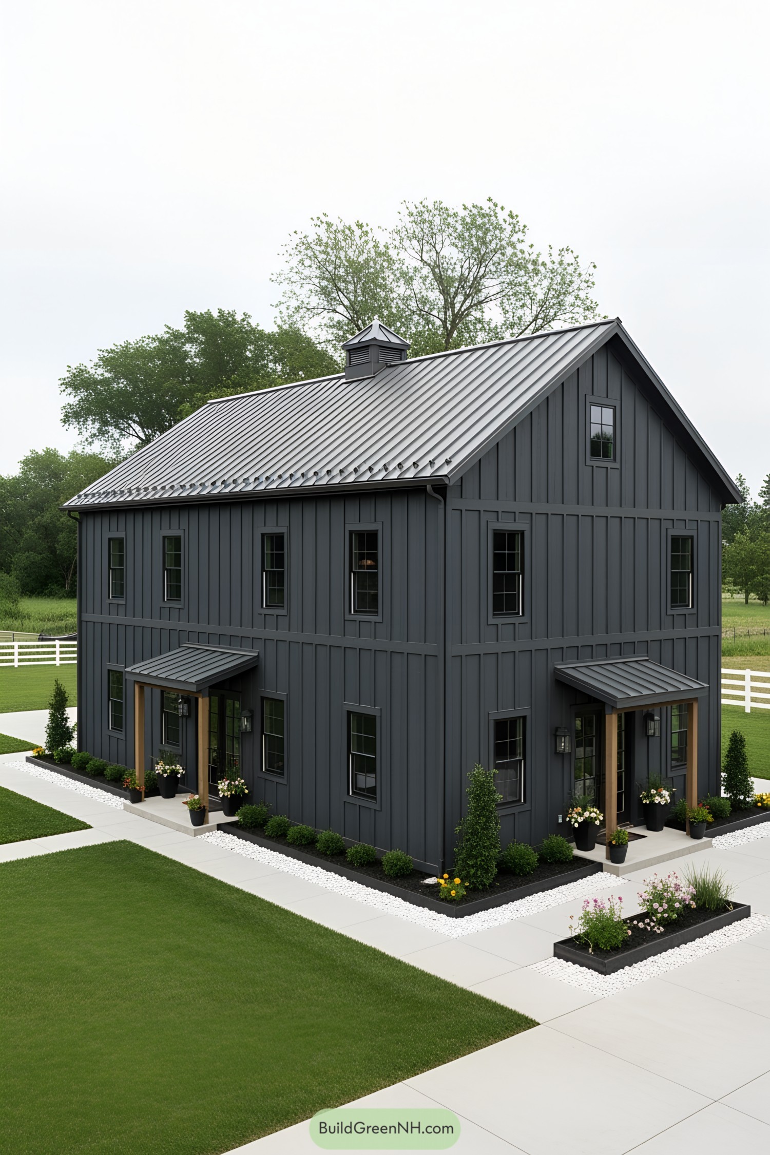 Dark gray modern barn house with crisp landscaping