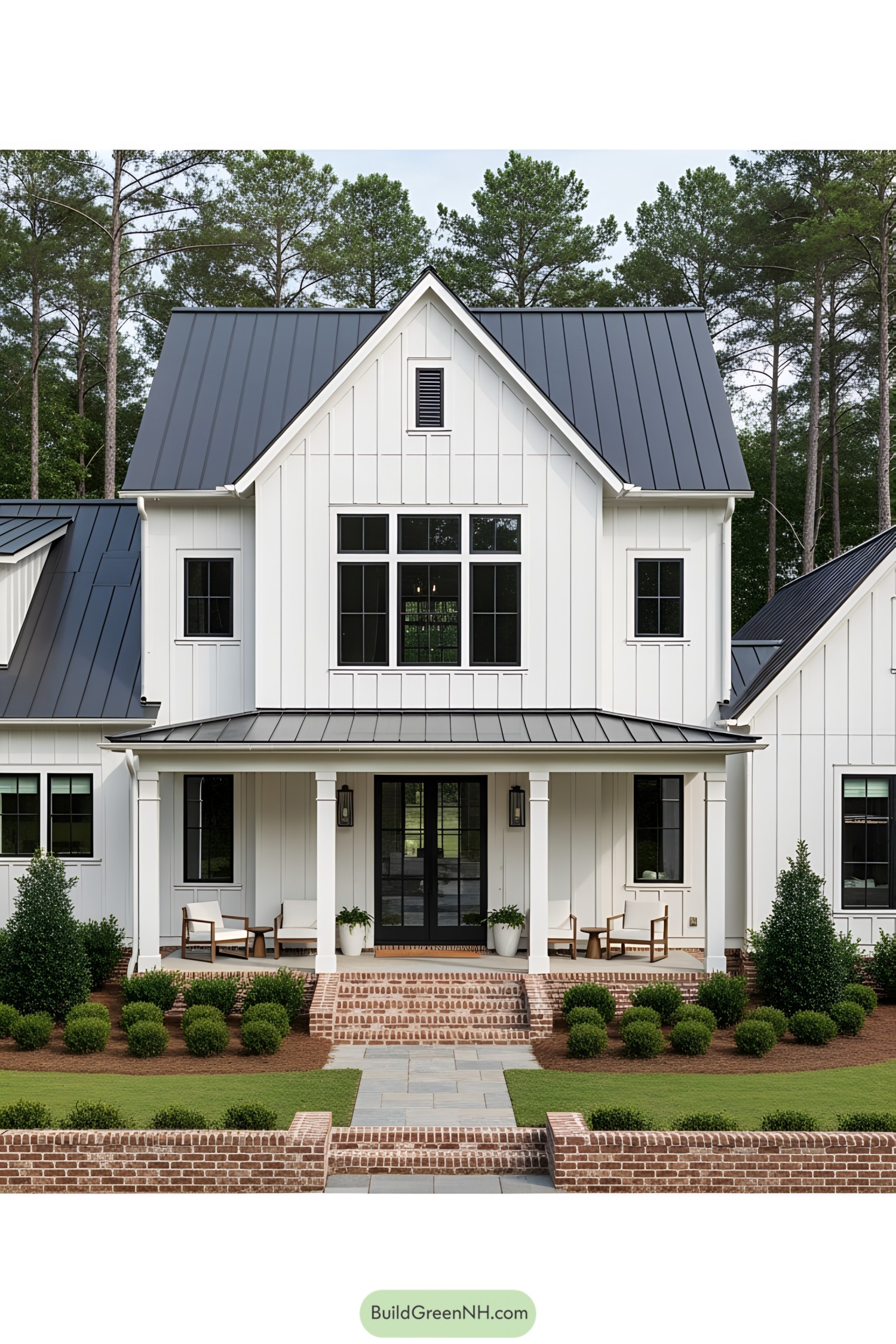 White farmhouse with black roof and front porch