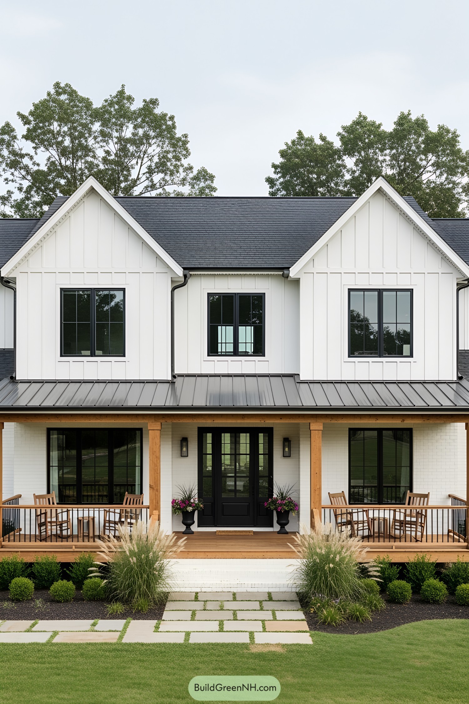 Modern white farmhouse with gabled roof and wooden porch