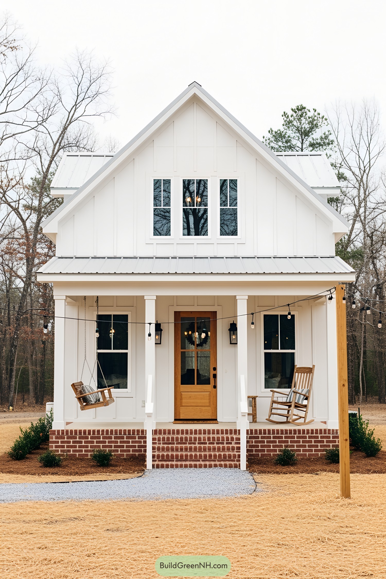 Compact white farmhouse with cozy porch swing and rocking chair