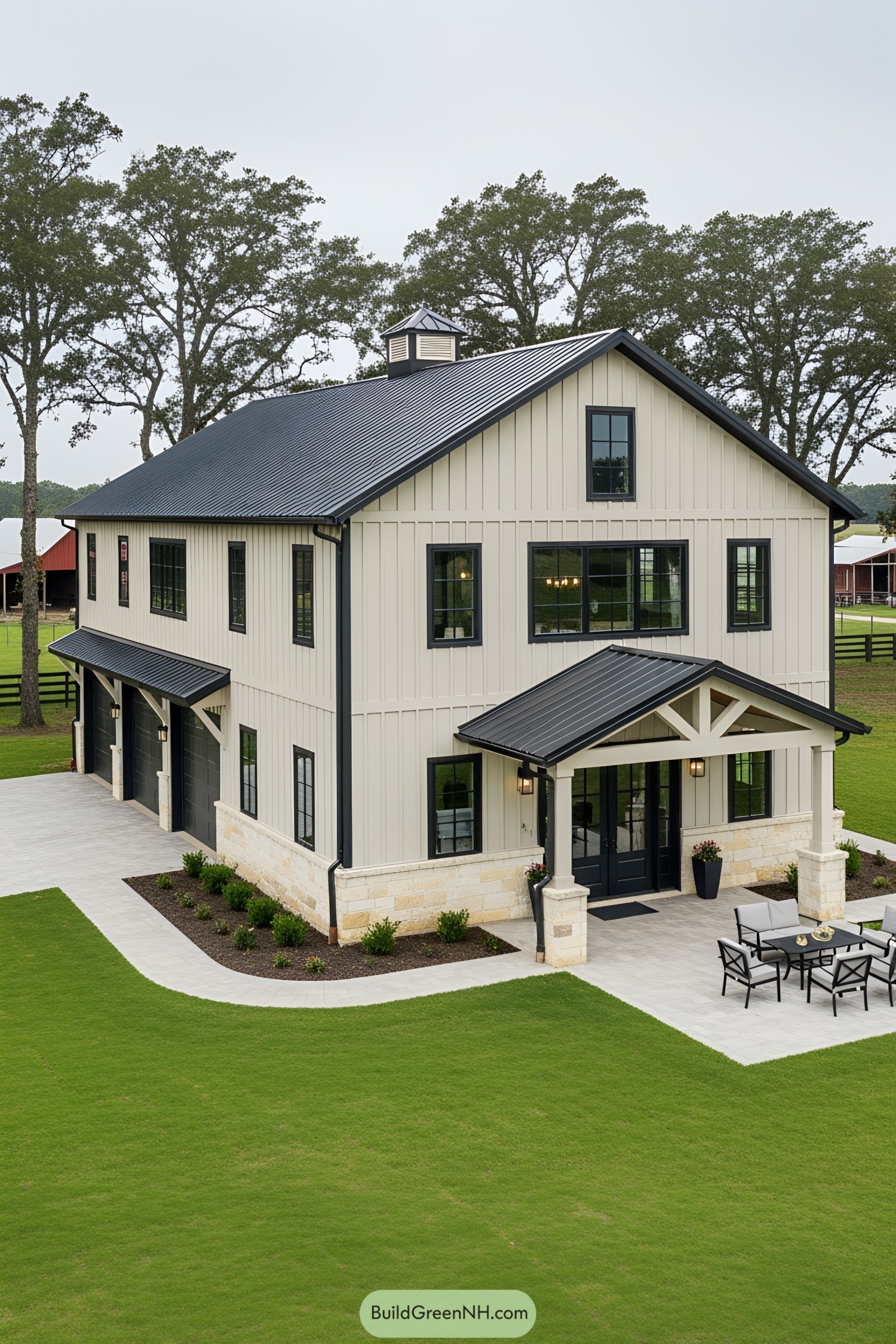 A luxurious two-story barndominium with a sleek metal roof and large windows