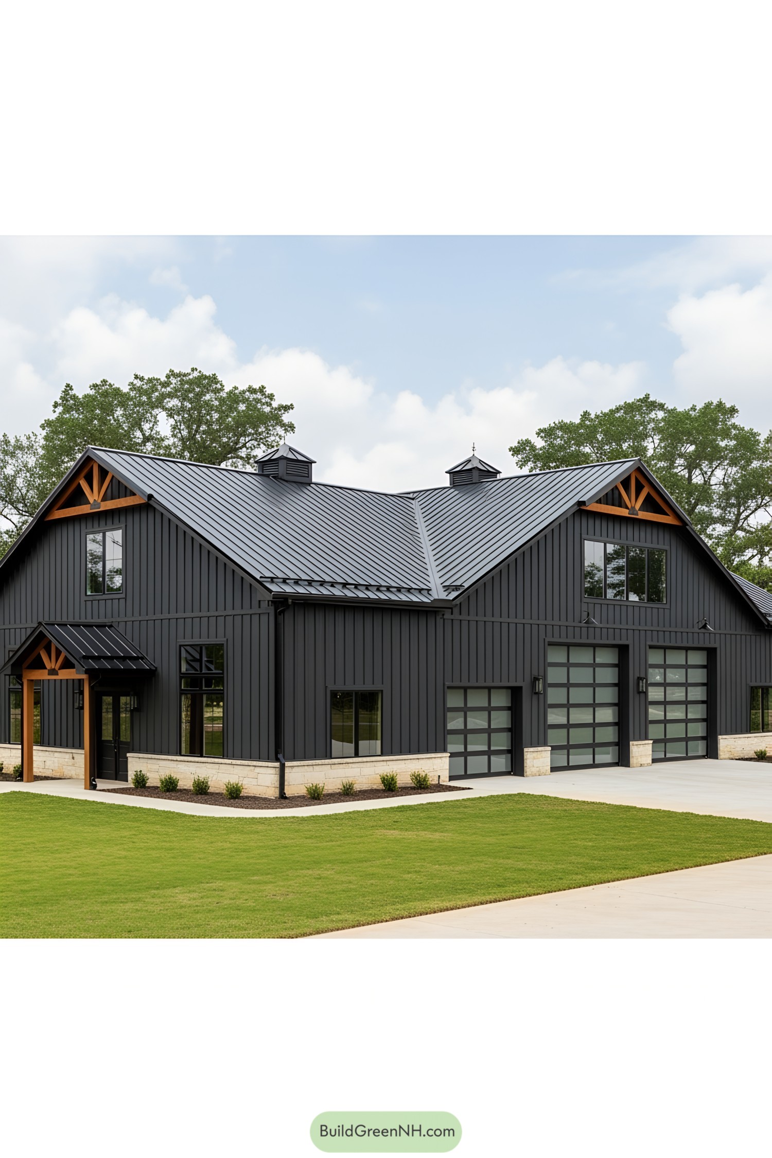 Massive black barndominium with a sleek metal roof and large glass doors
