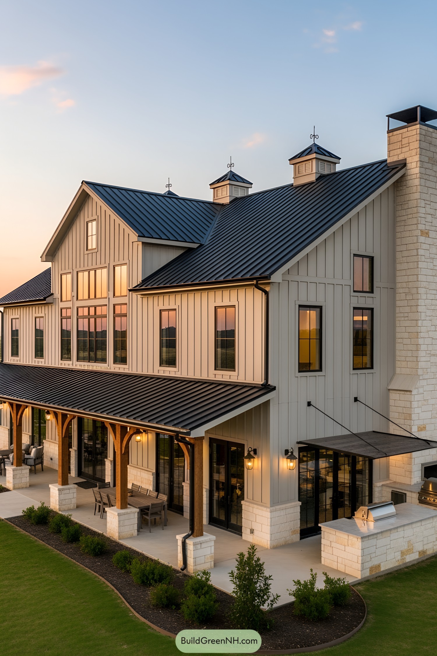 A large barndominium at sunset, blending rustic charm with modern elegance