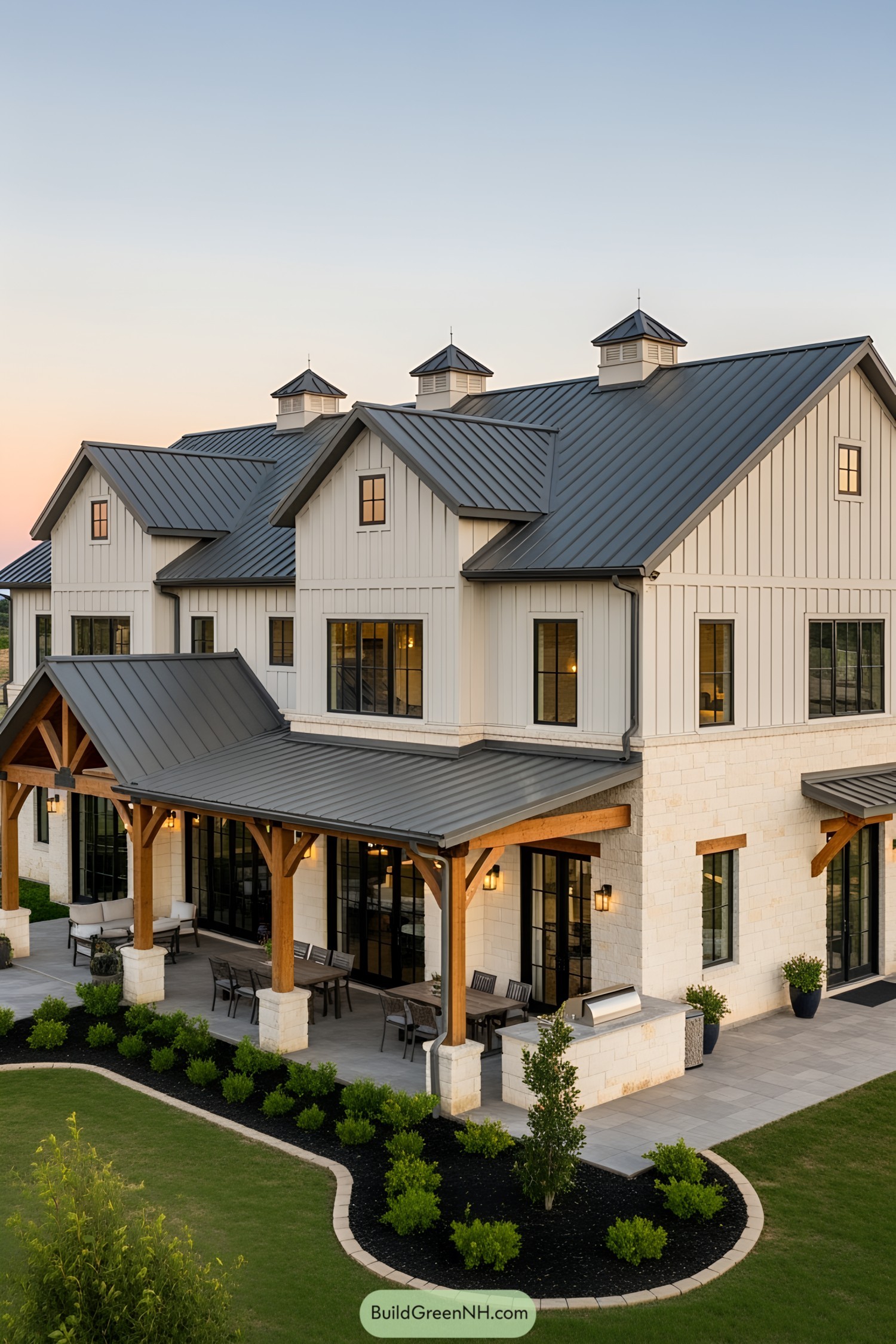Spacious barndominium with a grand porch and sleek roof